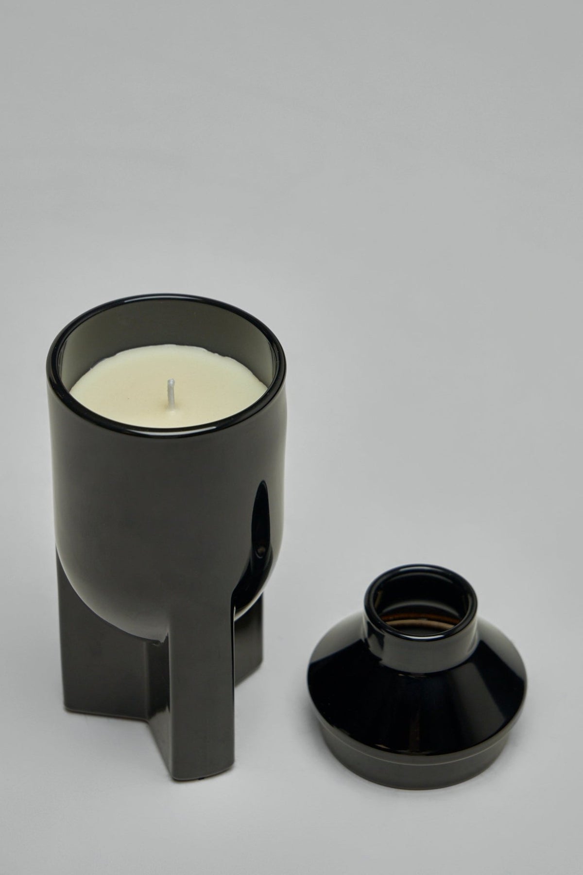 Premium vegetable wax candle by Rick Owens in sleek black glass vessel