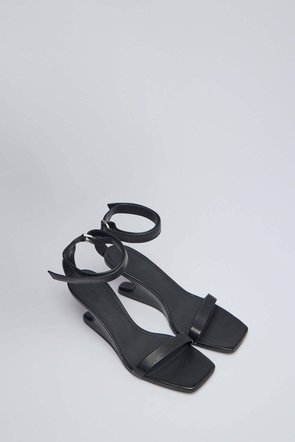 Side view of Rick Owens cantilever sandal showing unique floating heel design