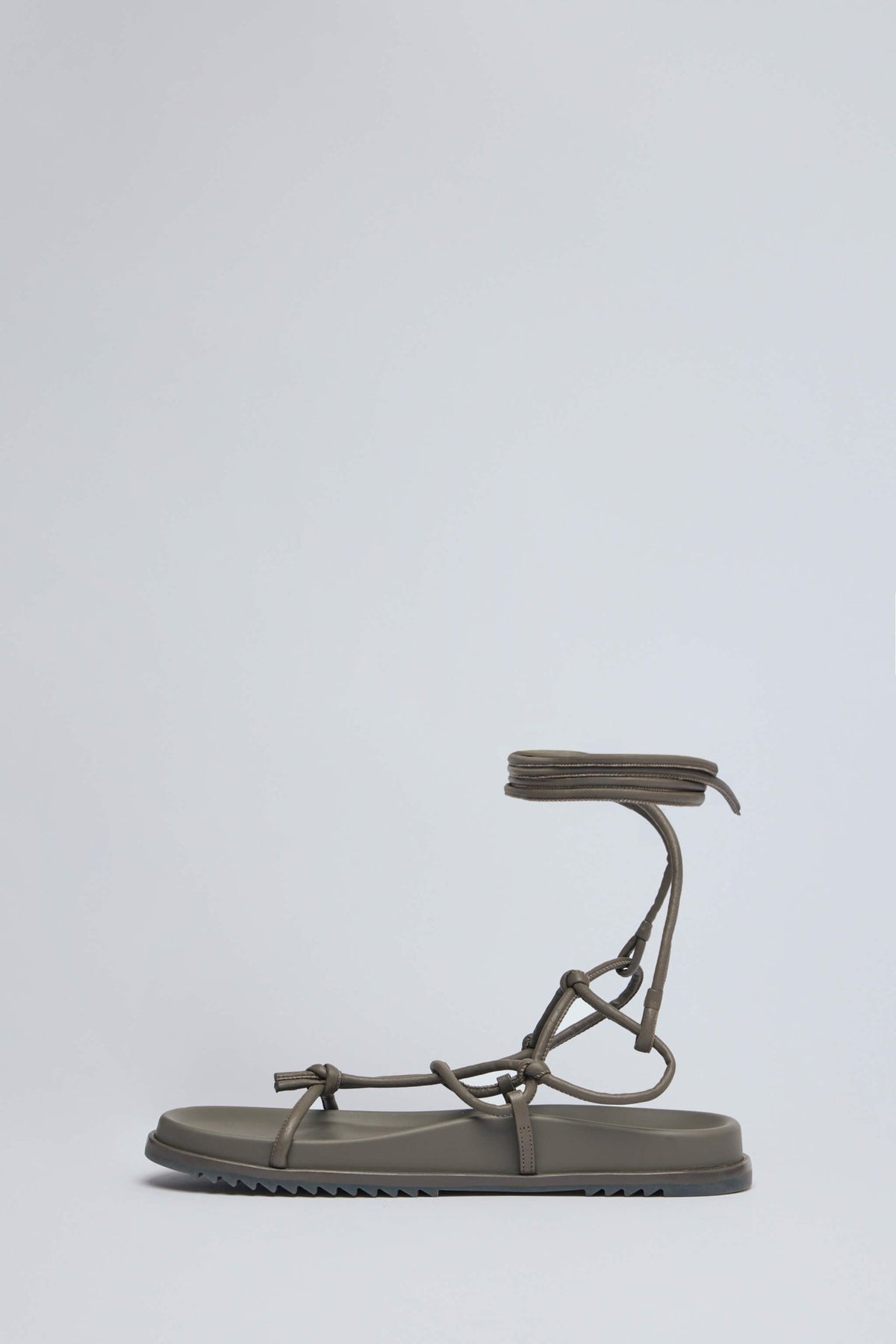 Detail shot of premium Italian leather texture on Rick Owens sandals