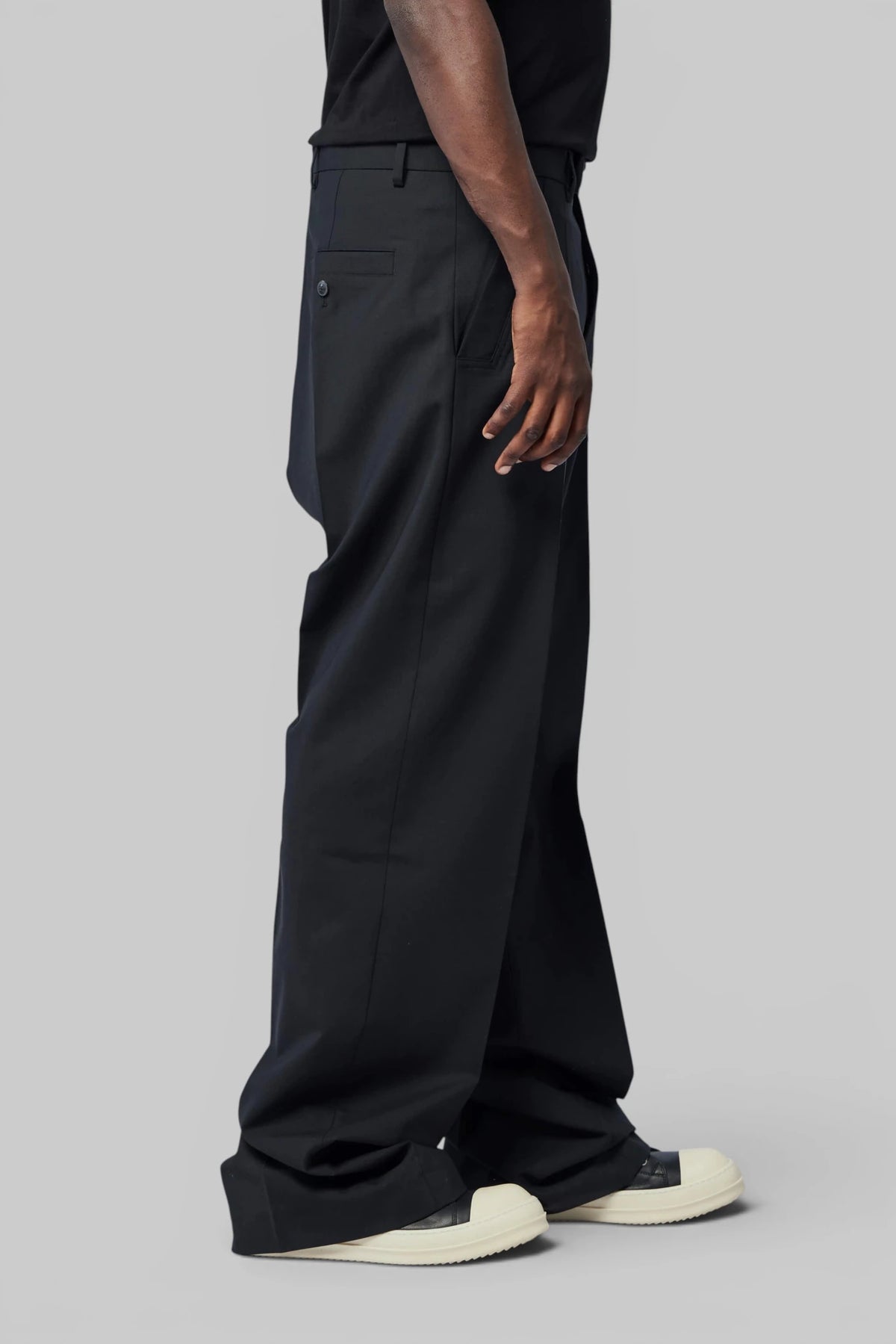 Rick Owens wide-leg pants styled with structured outerwear