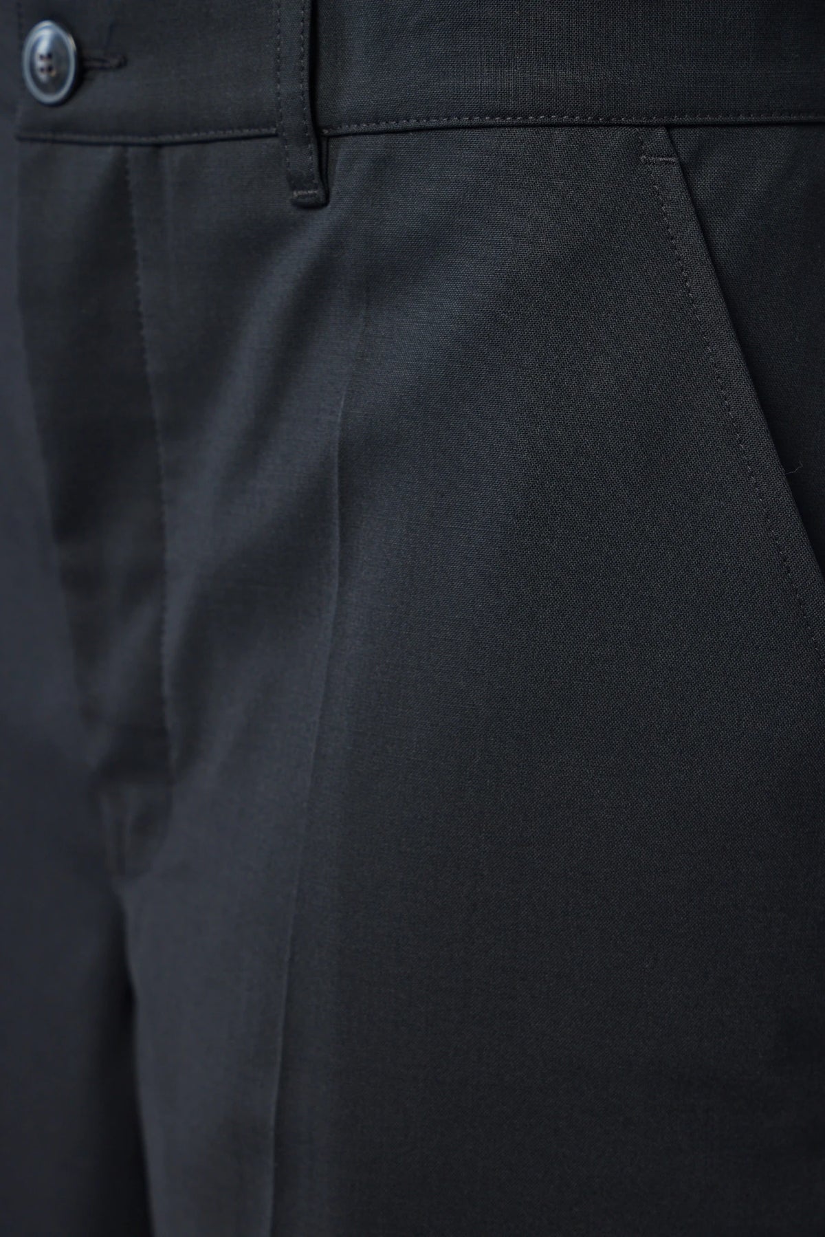 Back view showing tailored silhouette of the trousers
