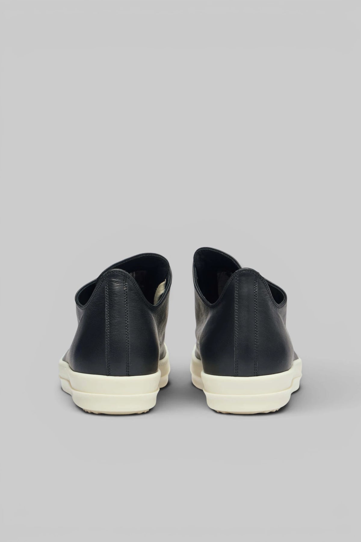 Rick Owens black leather sneakers styled with cargo pants