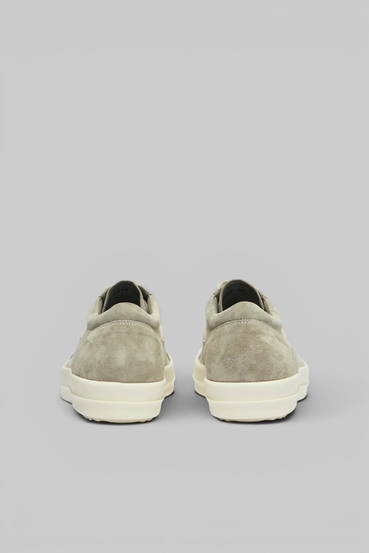 Rick Owens low top sneakers styled with tailored trousers