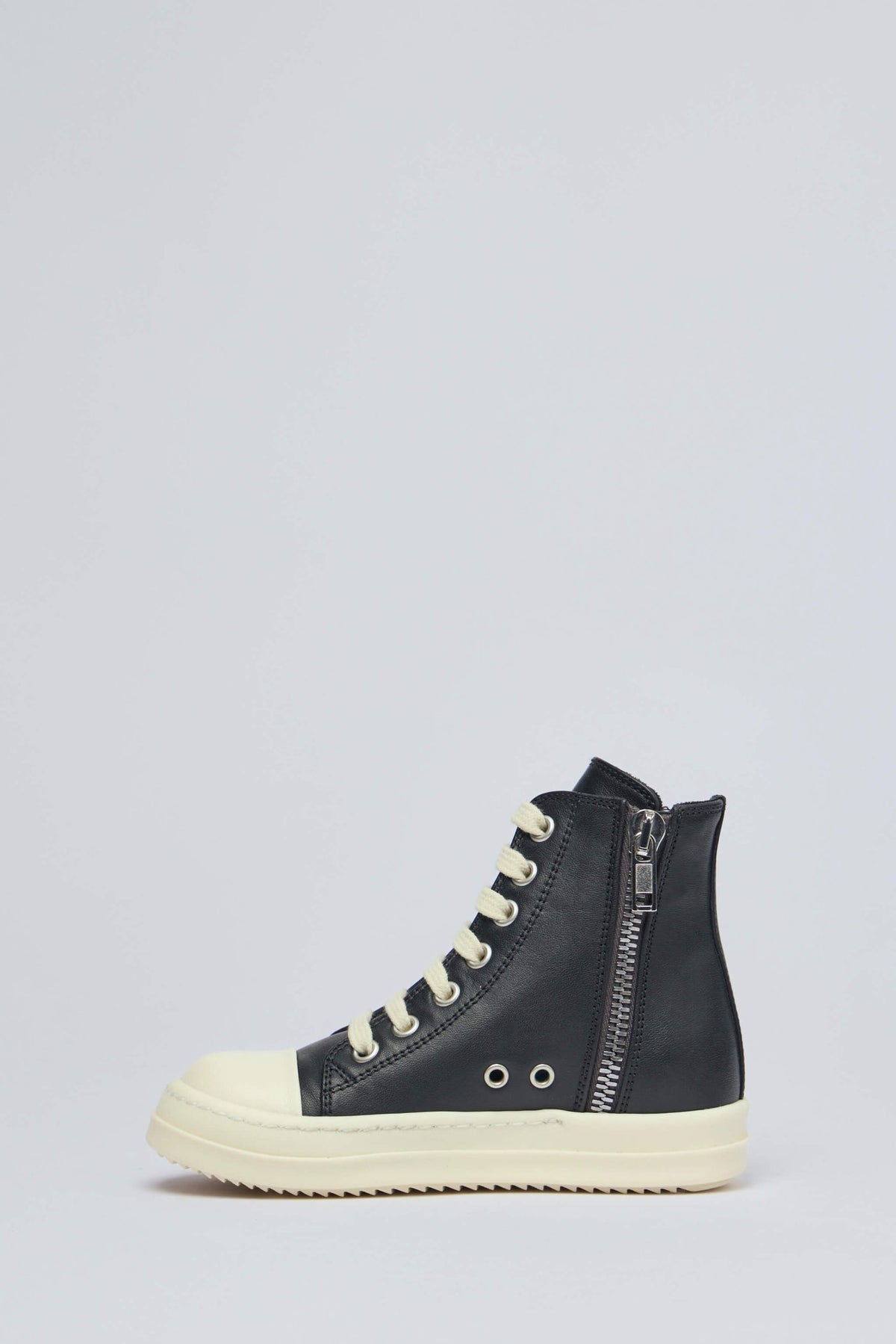 Detail shot of Rick Owens sneaker sole with ribbed texture and cream colorway