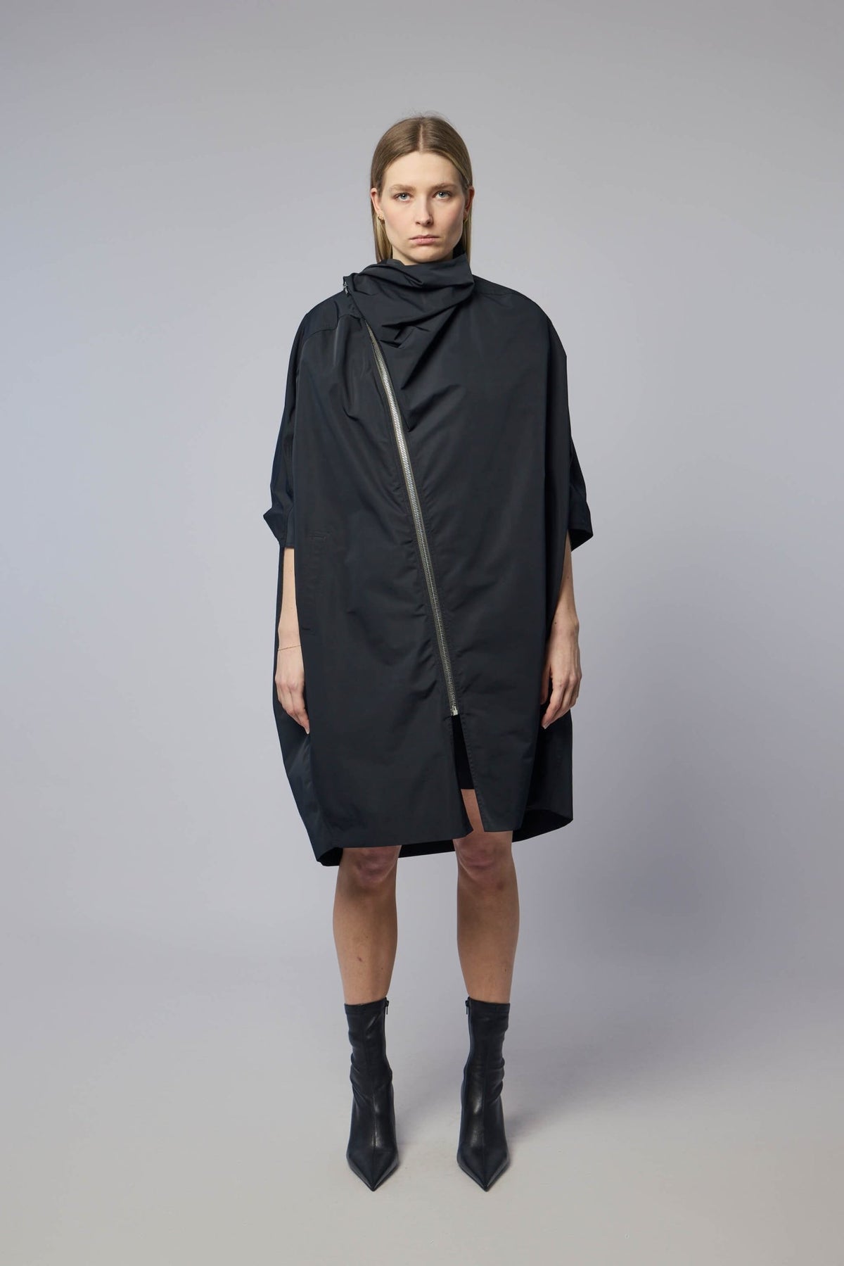 Close-up of diagonal zipper closure on Rick Owens woven coat