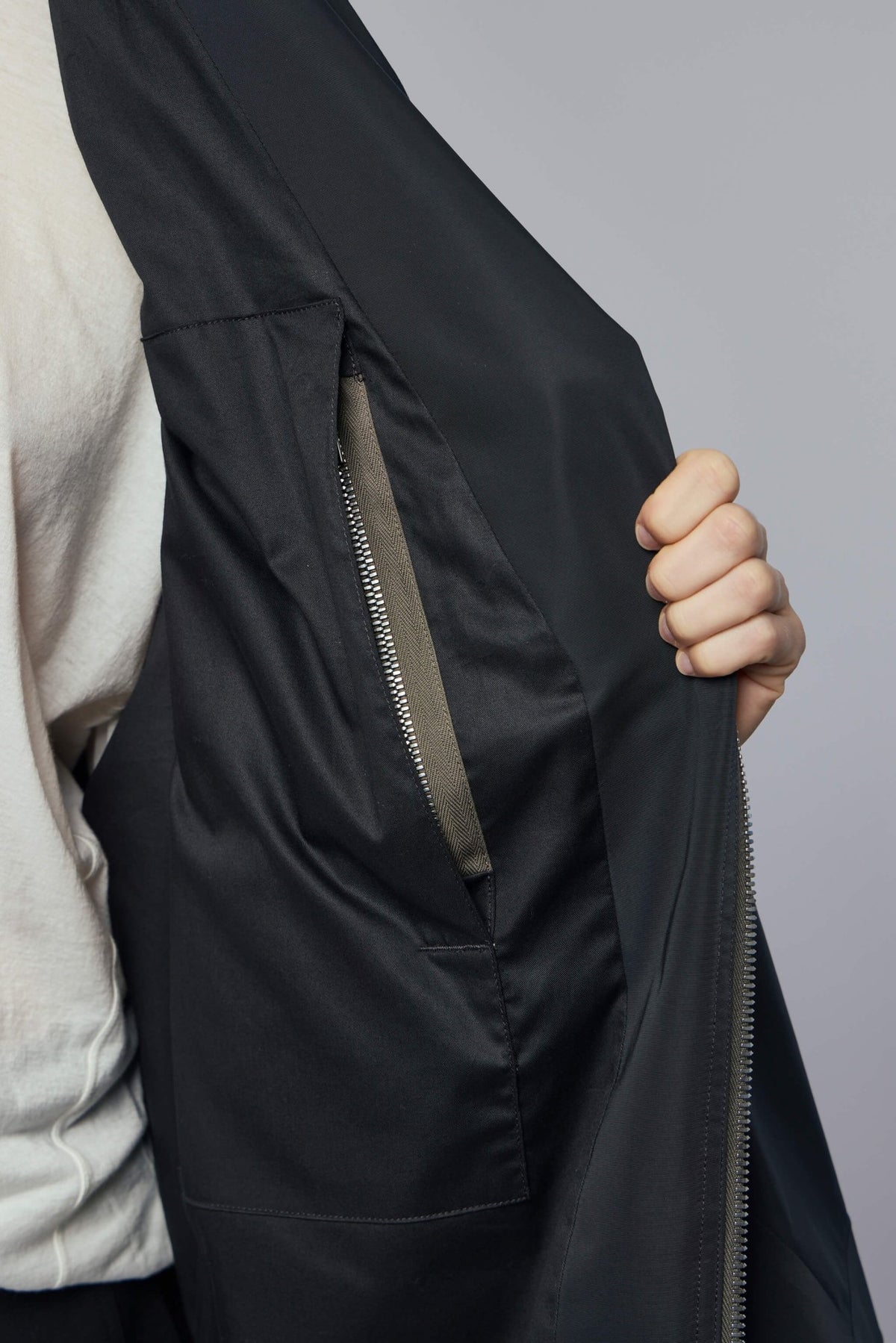 Detail shot of premium polyester fabric texture on Rick Owens coat