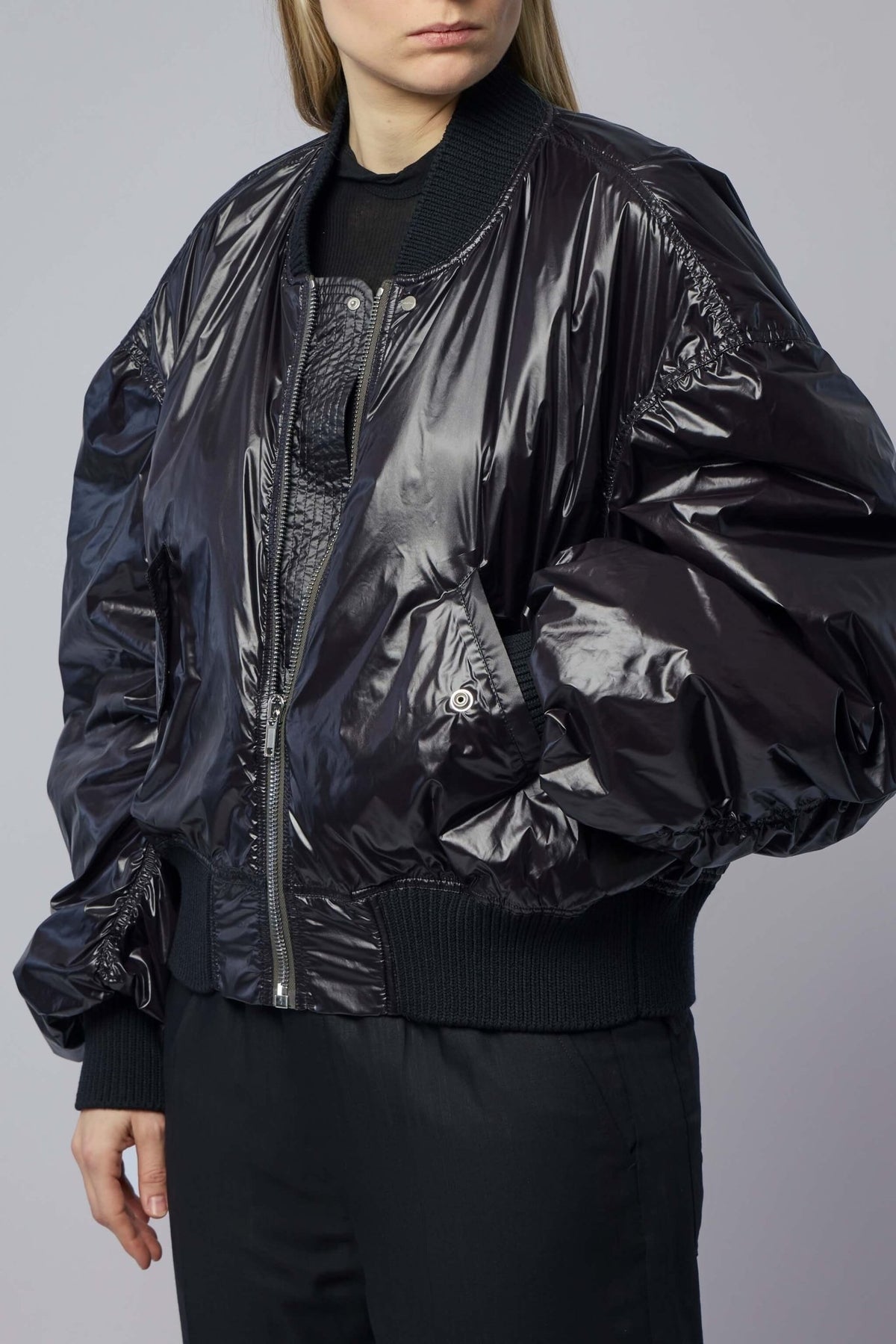 Model wearing Rick Owens black bomber jacket showcasing boxy fit and architectural silhouette