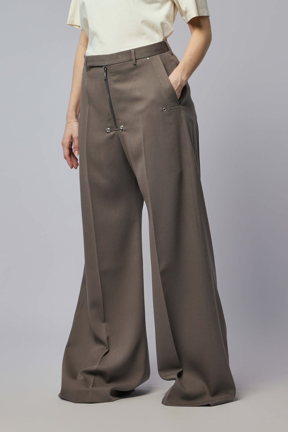 Model wearing Rick Owens tailored wide-leg pants in sophisticated Belas Dust color