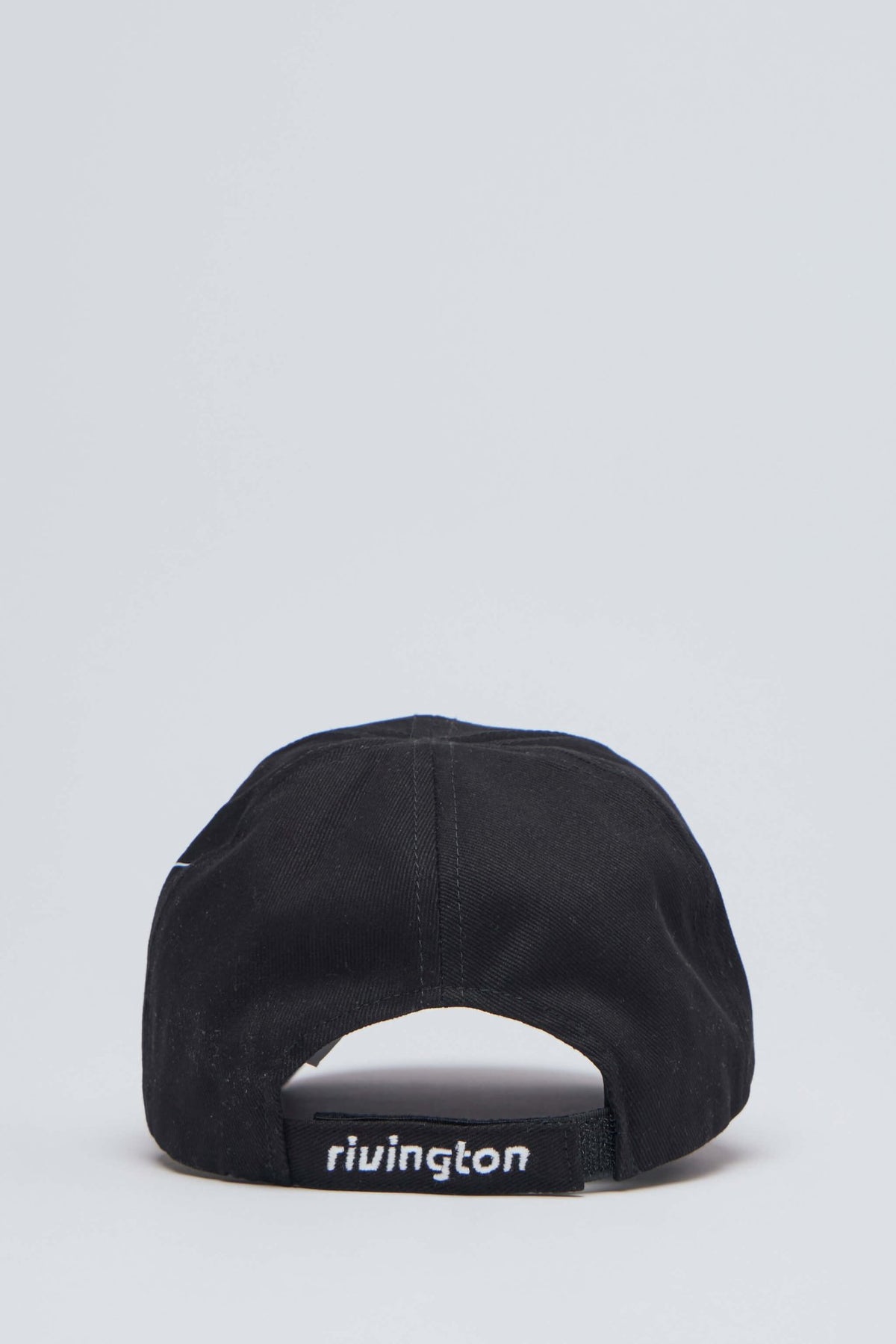 Detail shot of Rivington roi Rebis branding on premium cotton cap