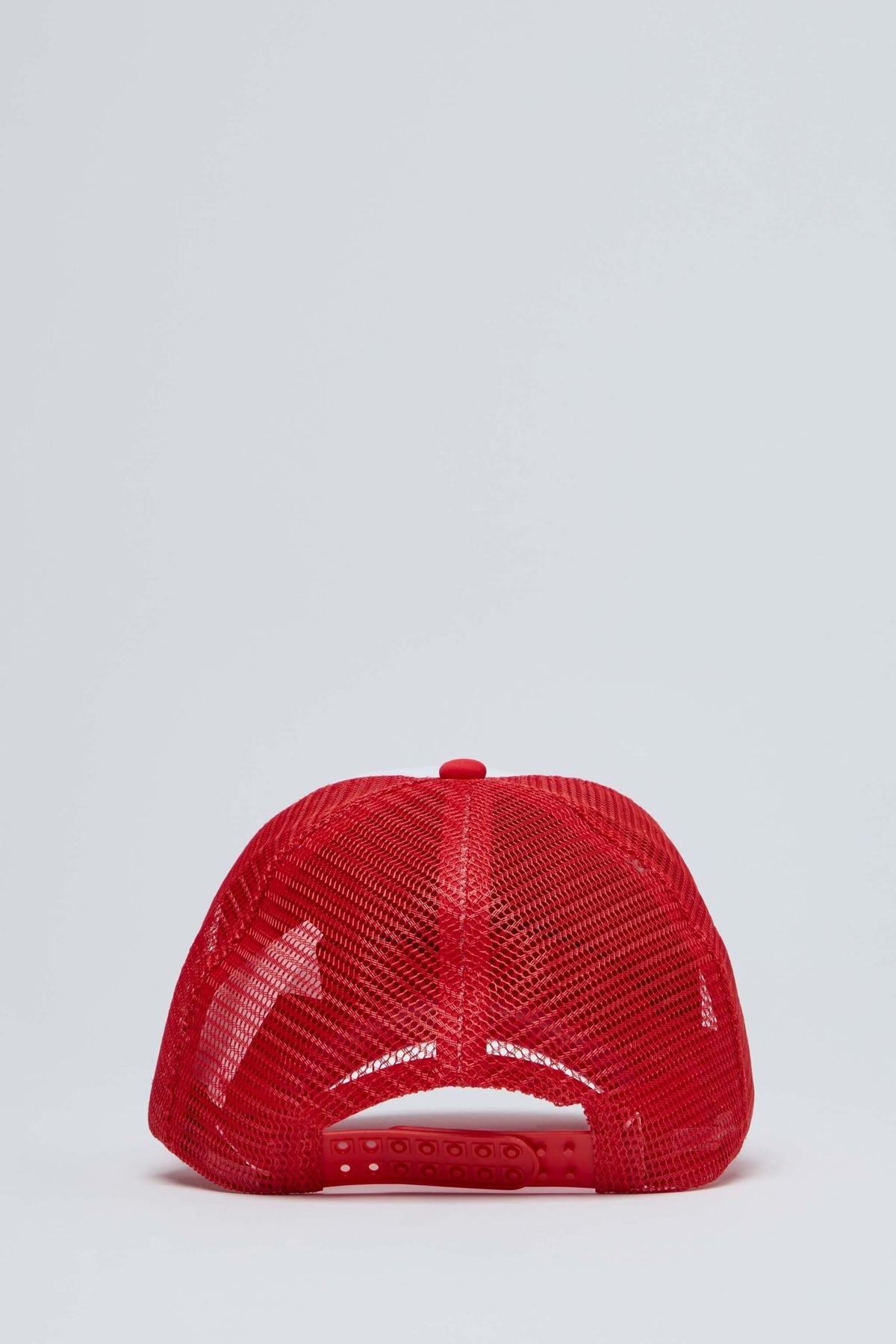 Styled shot of Secret Societies trucker hat with contemporary streetwear