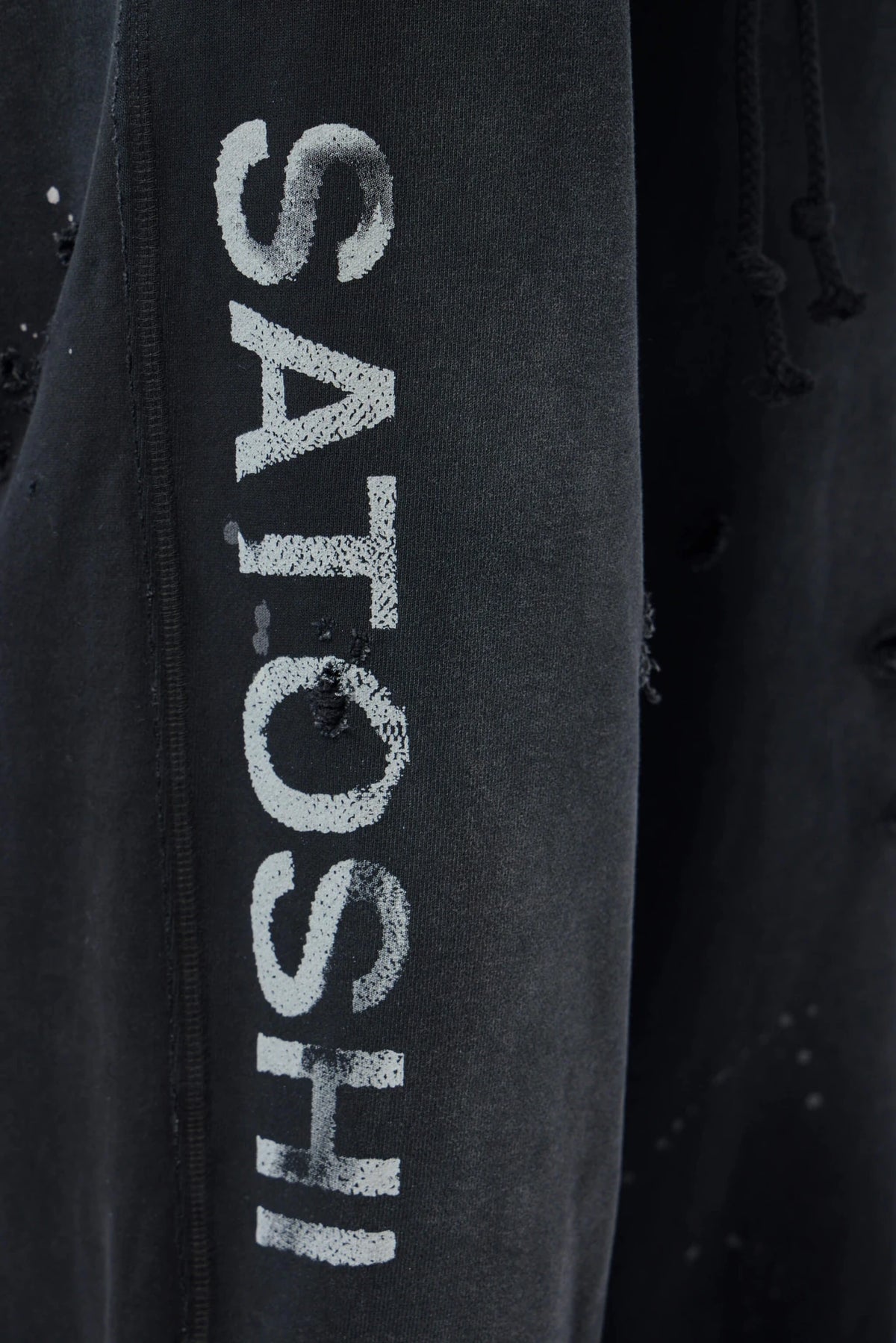 Model wearing Satoshi Nakamoto fleece pants full outfit, view 6