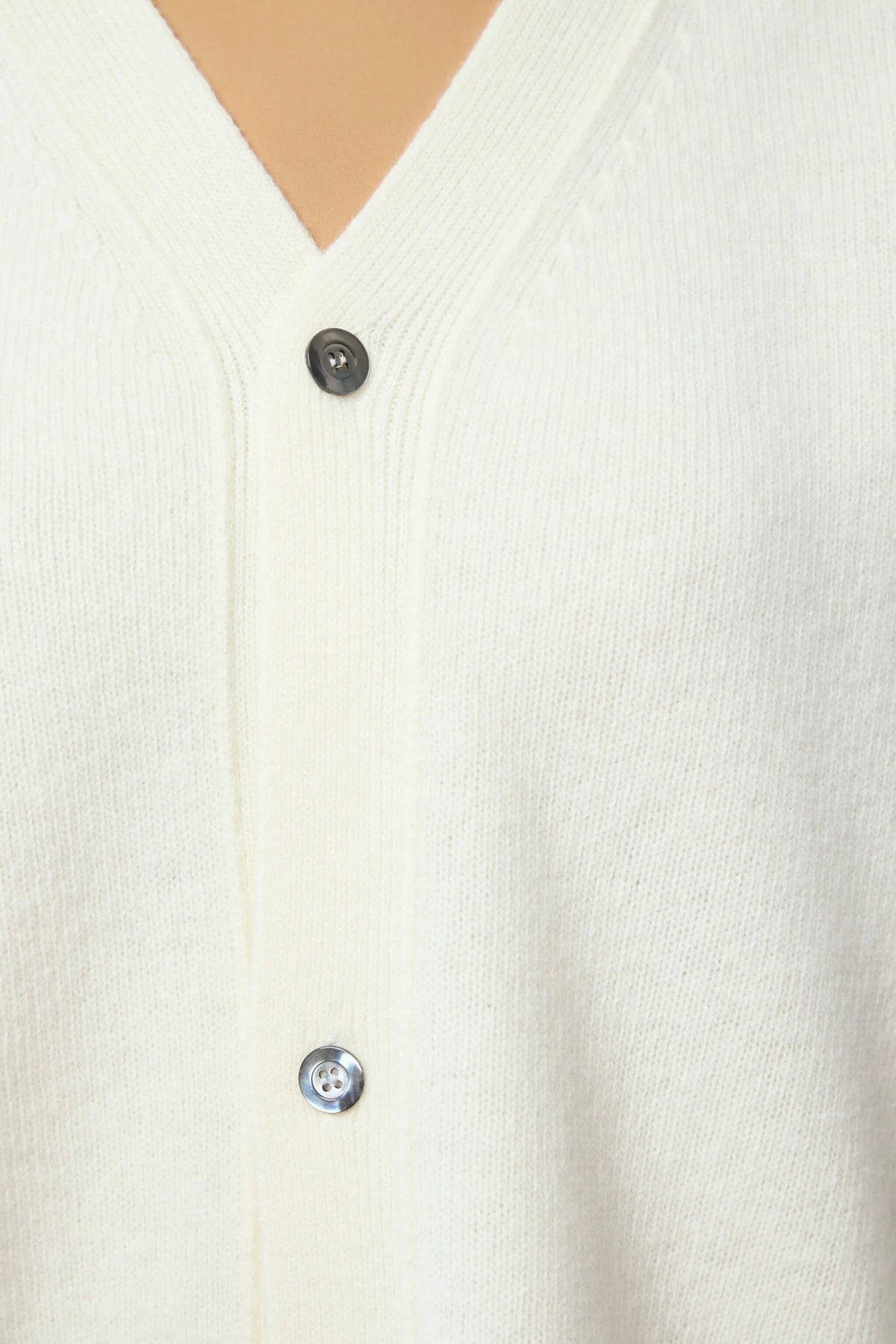 Sofie D'Hoore cardigan draped open over layered outfit