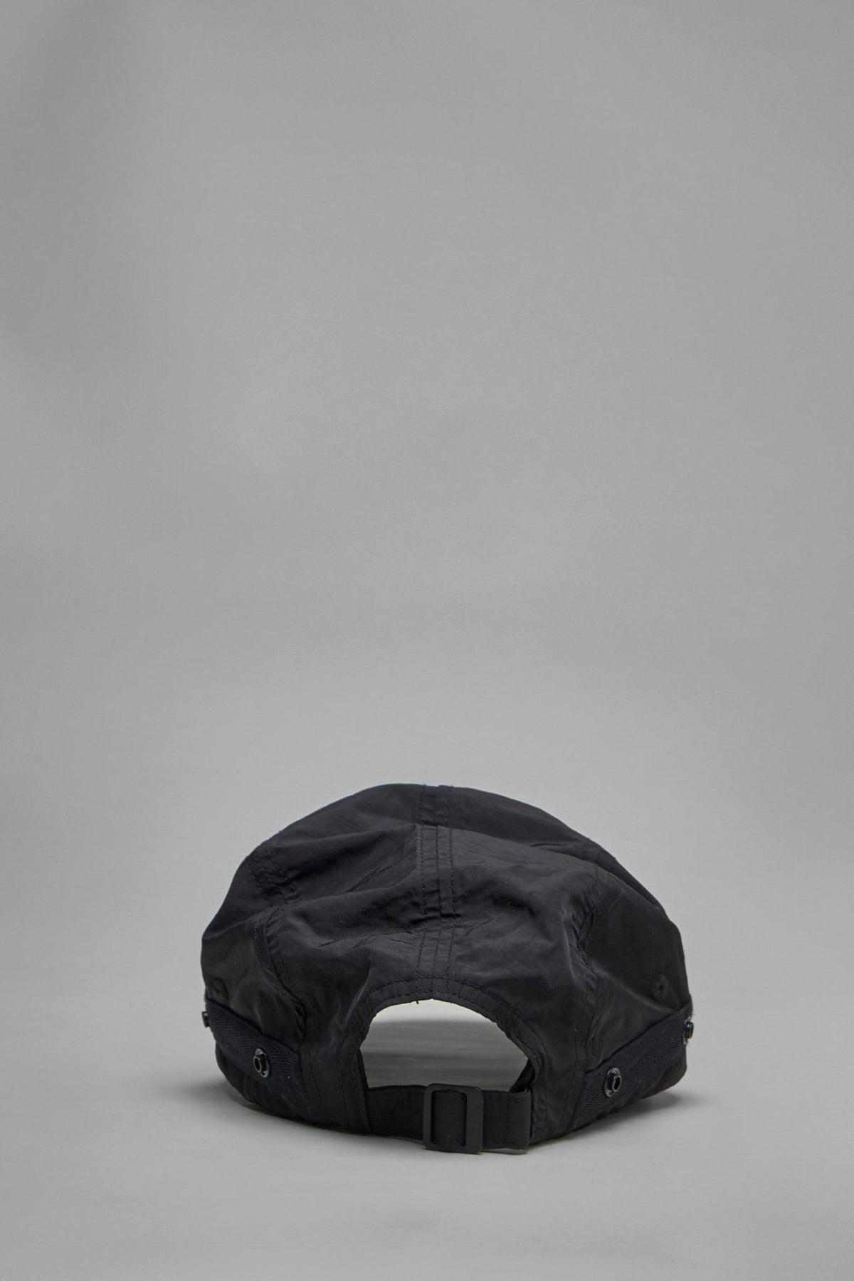 Flat lay styling of cap with flaps both attached and detached