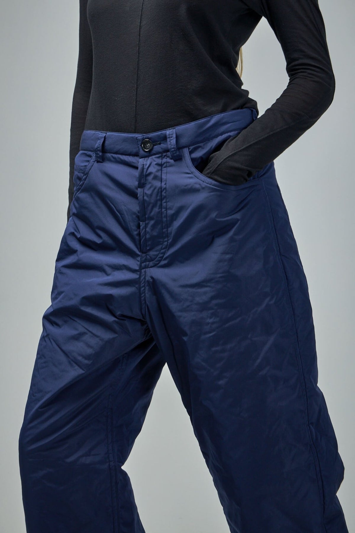 Side view of wide-leg pants highlighting contemporary silhouette and styling