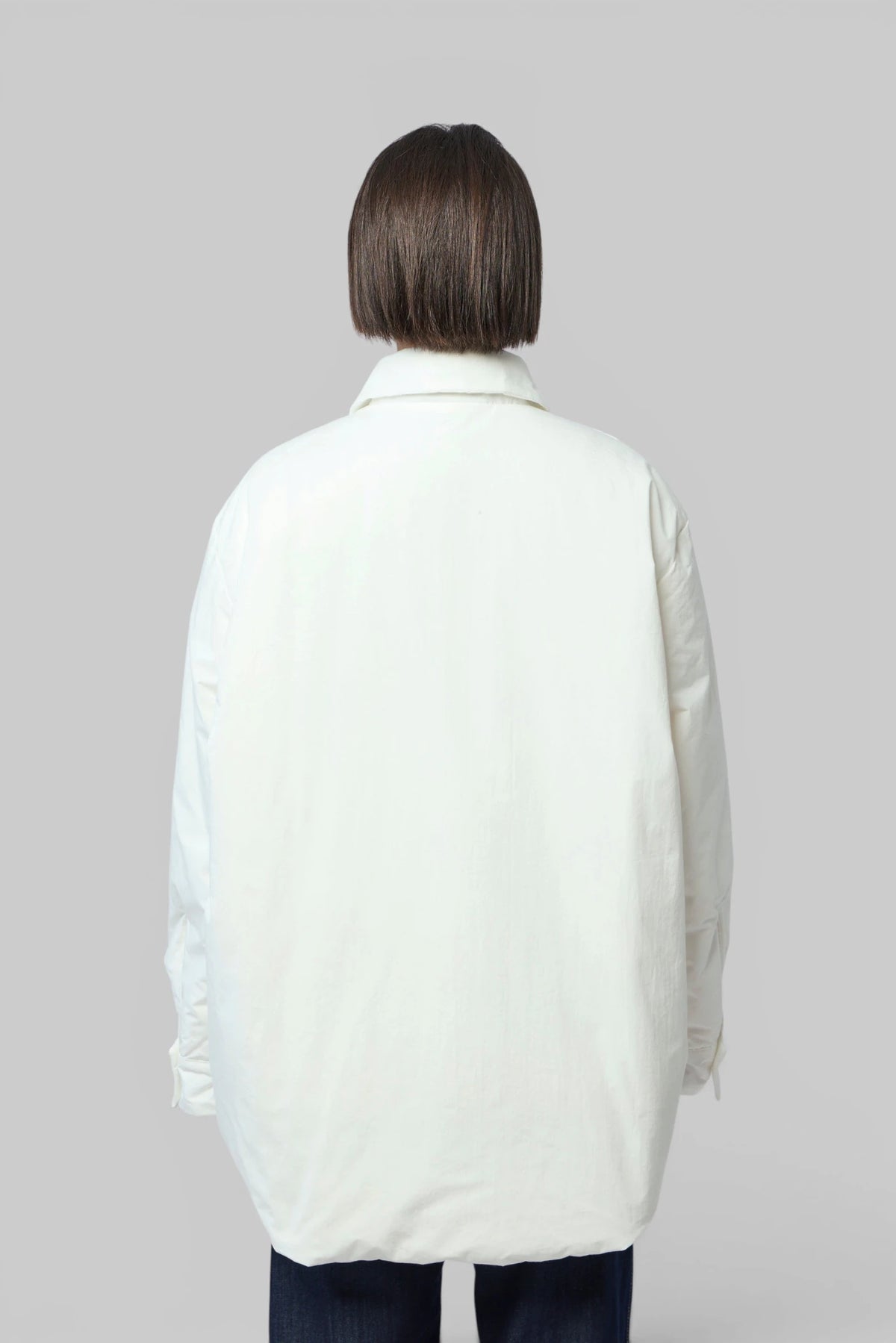 Back view of Sofie D'Hoore light weight down jacket showing straight hemline
