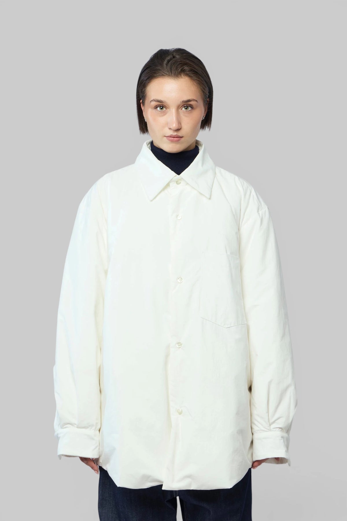 Close-up of button-up front on Sofie D'Hoore down jacket