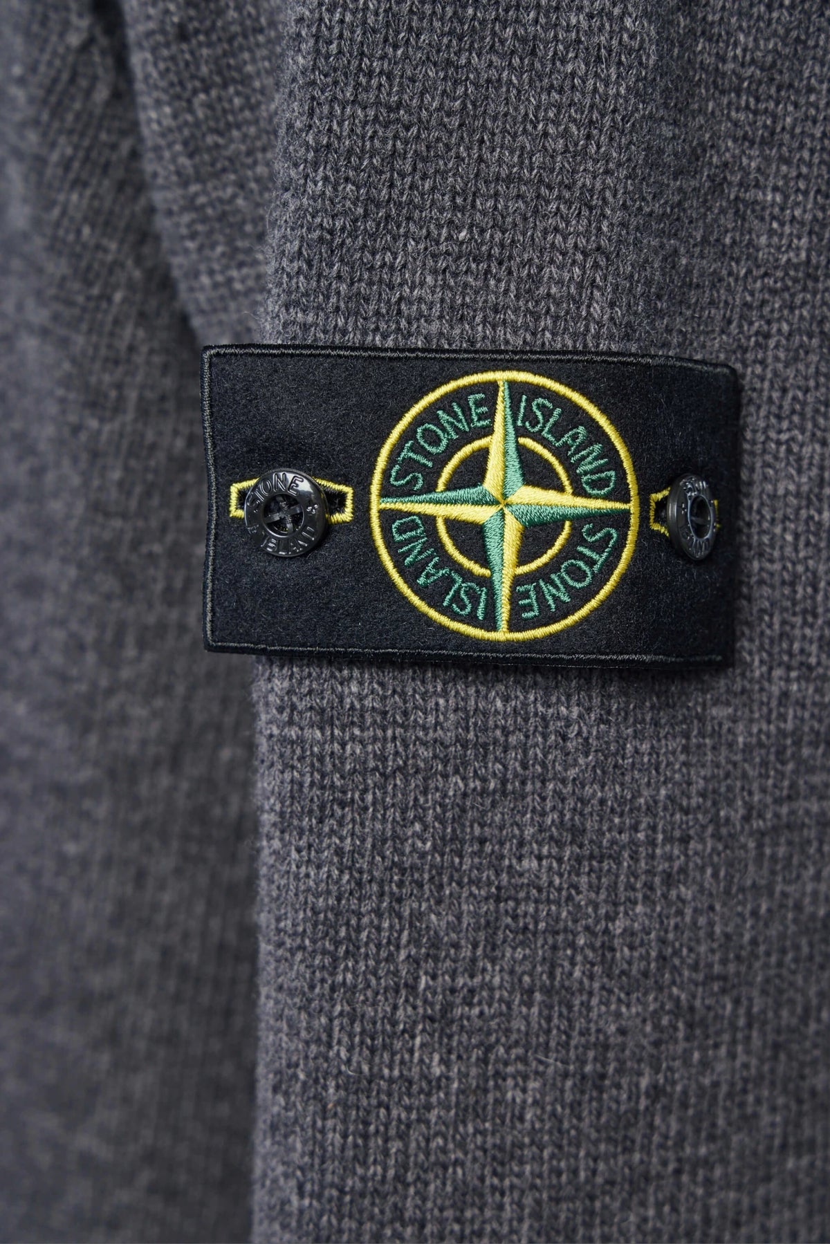 Stone Island cardigan folded to show knit texture