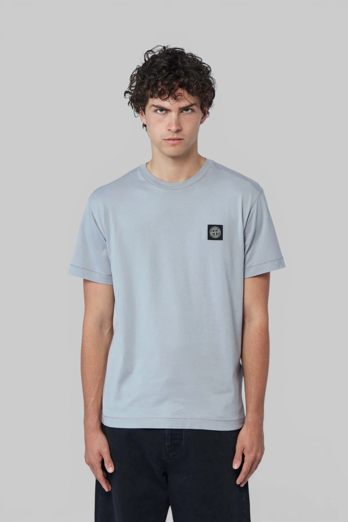 Close-up of chest logo patch on Stone Island cotton T-shirt