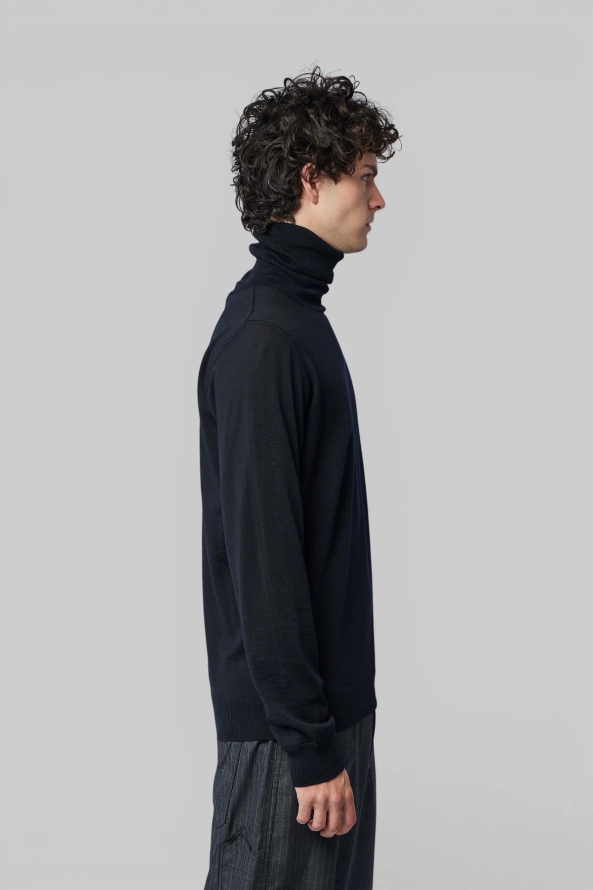 Stone Island wool sweater styled with tailored trousers