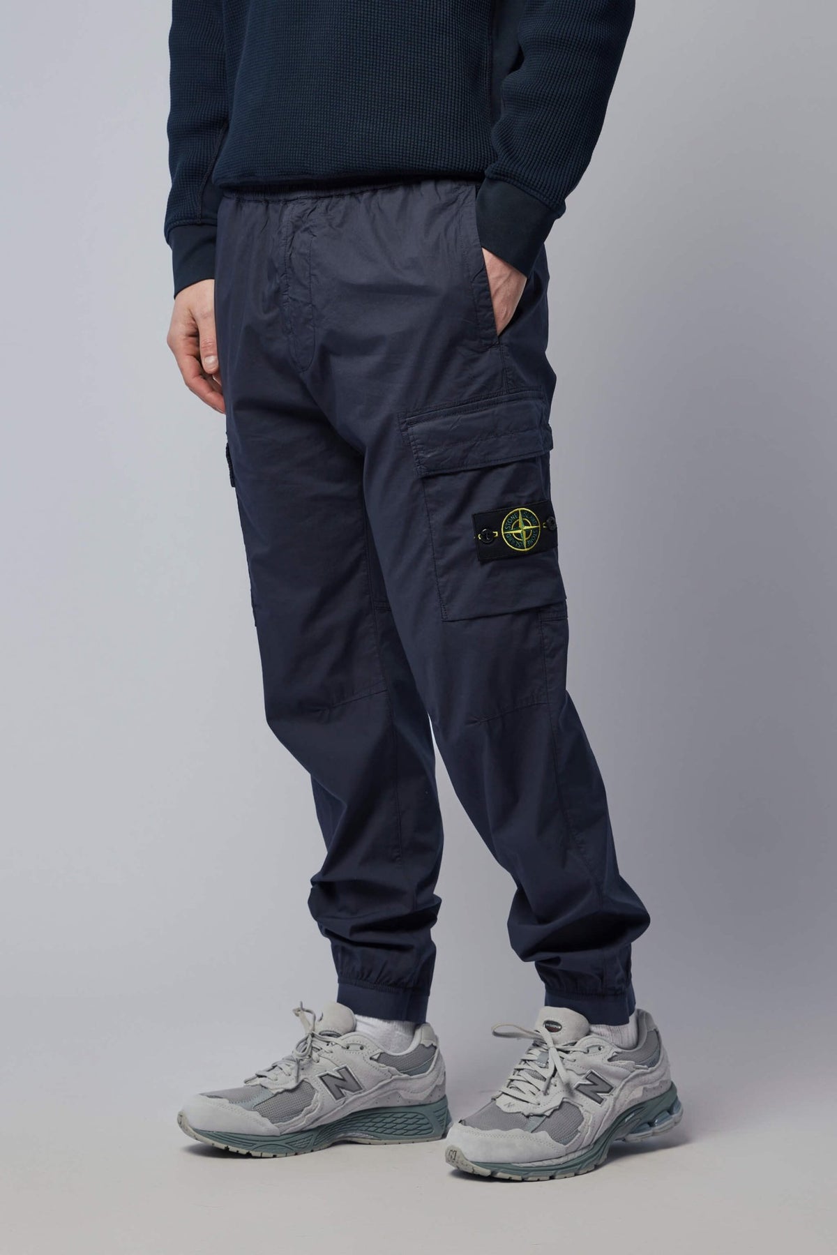 Side view showing cargo pocket details and relaxed fit silhouette