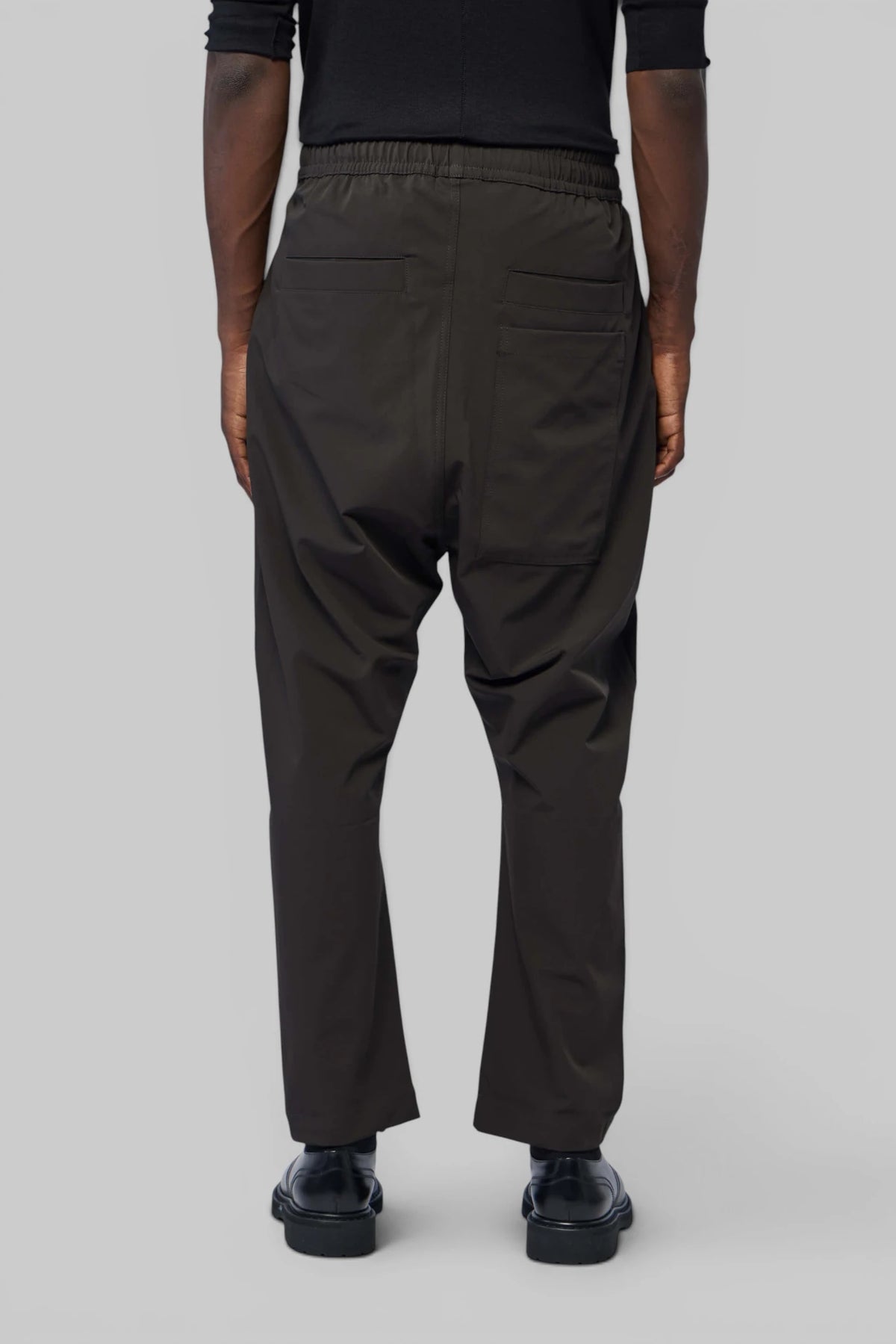 Back view highlighting stitching details on Thom Krom pants