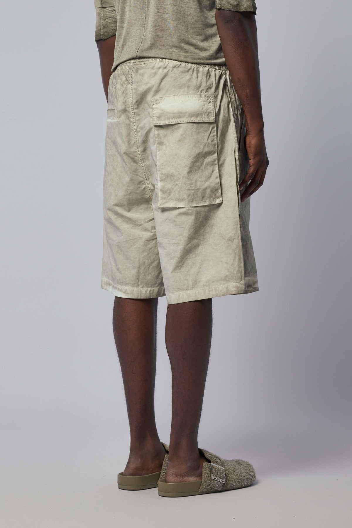 Button detailing and fabric texture on premium cargo pants