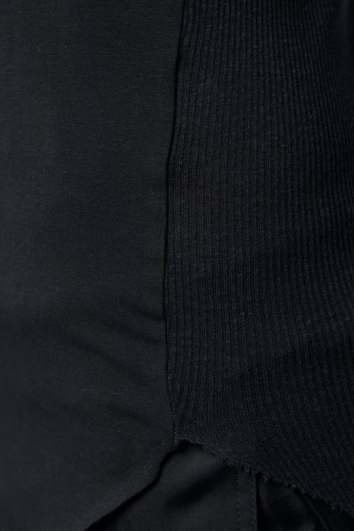 Back view of Thom Krom tank top displaying sleek cut and premium finish
