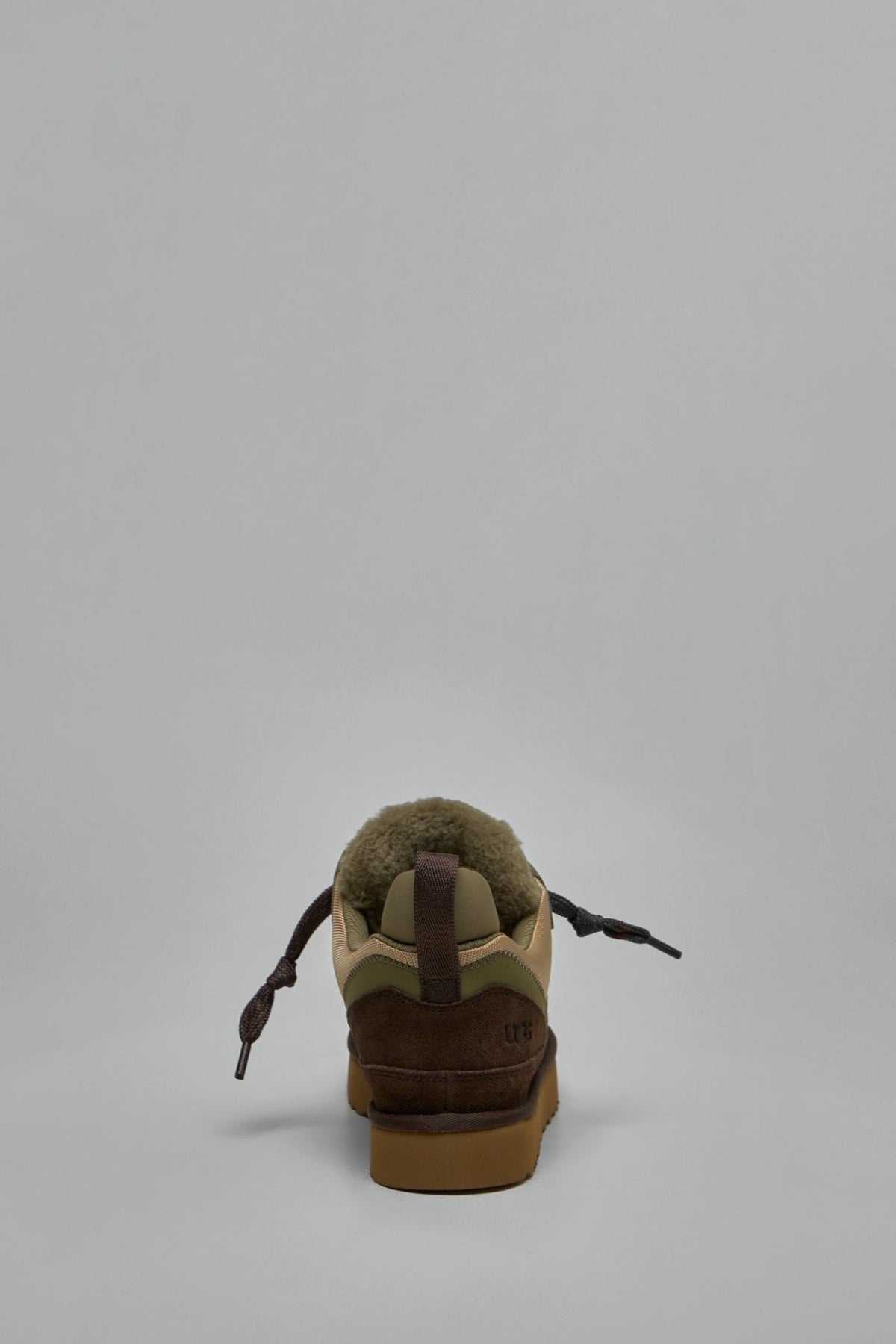 Close-up of UGG Lowmel sneaker leather upper and lace-up design