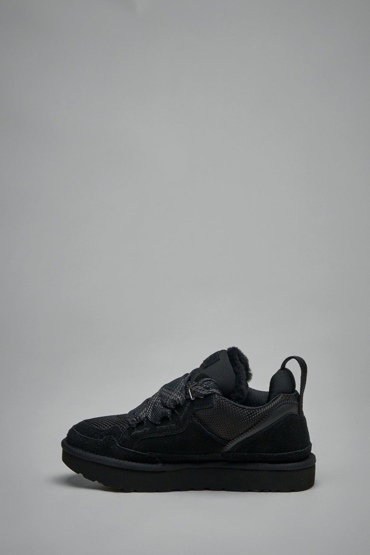 Detail shot of UGG sneaker mesh upper and metal eyelets