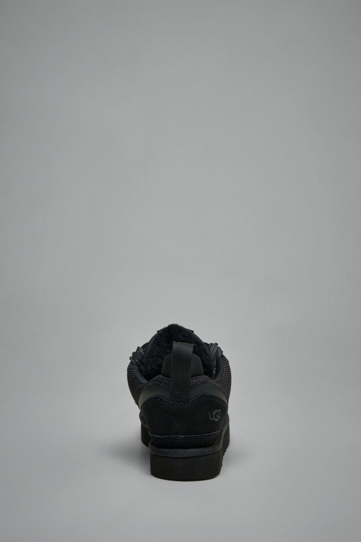 Back view of UGG Lowmel showing heel pull tab and logo embossing