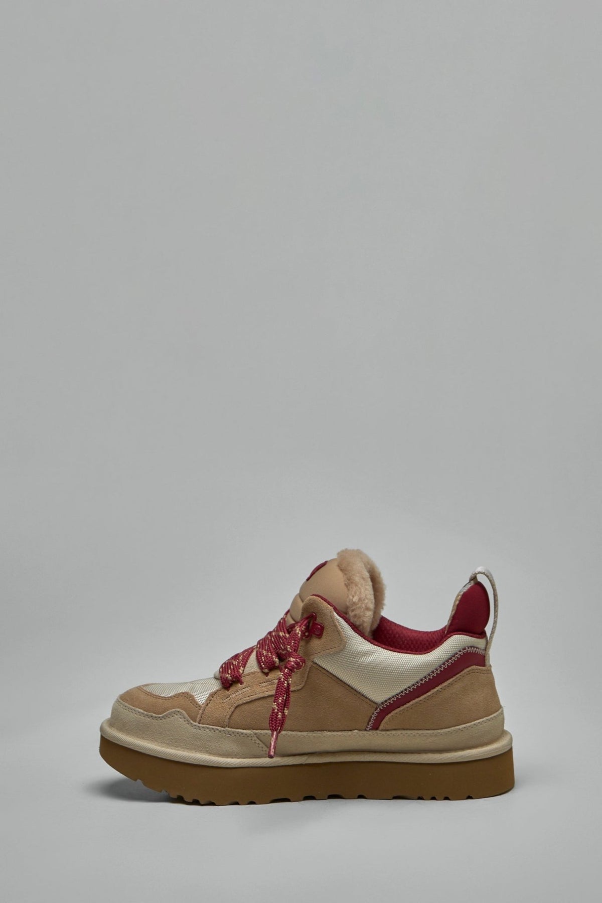 Close-up of UGG Lowmel sneaker heel tab and branding details