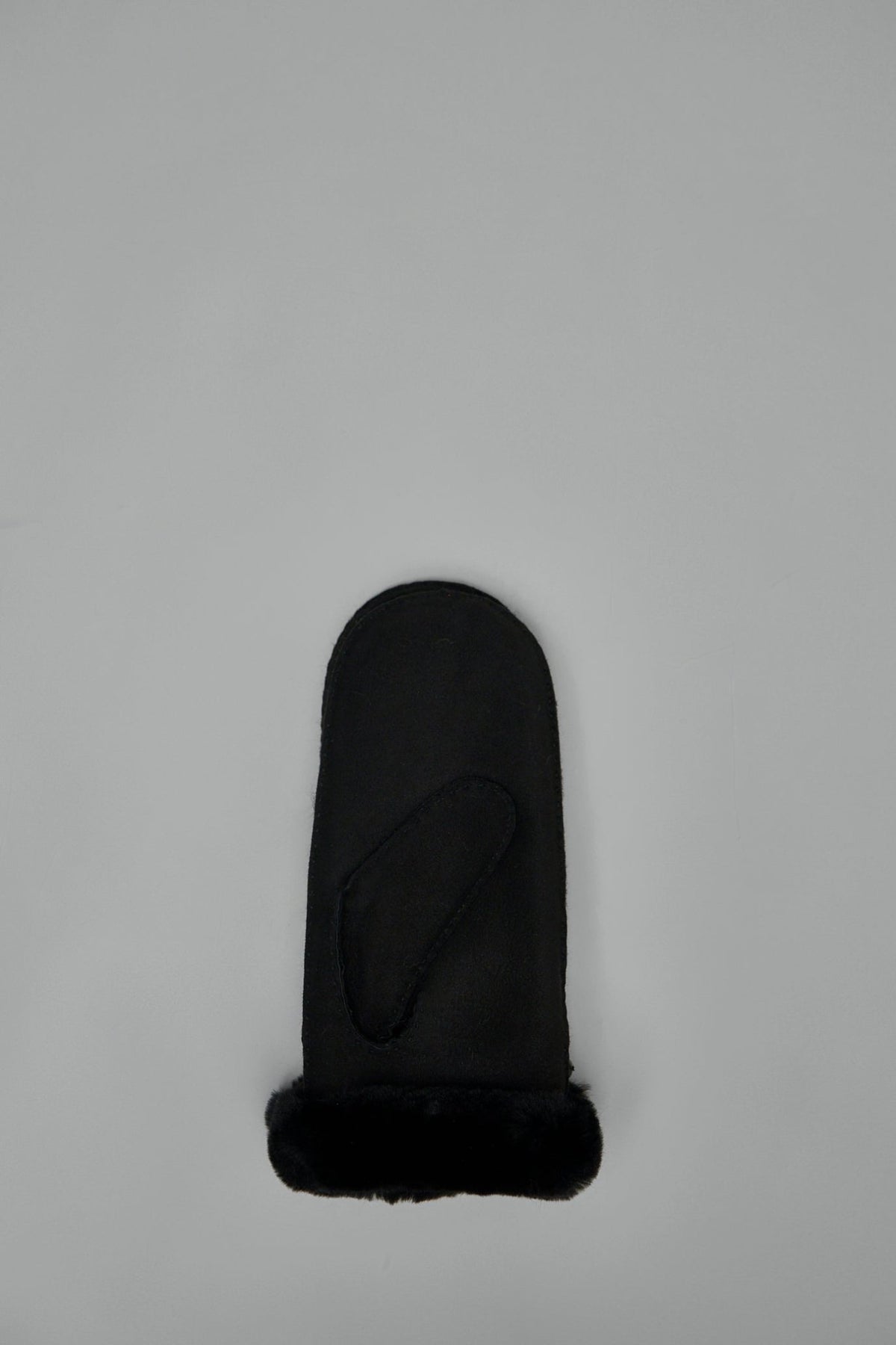 Side view of UGG mittens displaying fur trim at wrist opening
