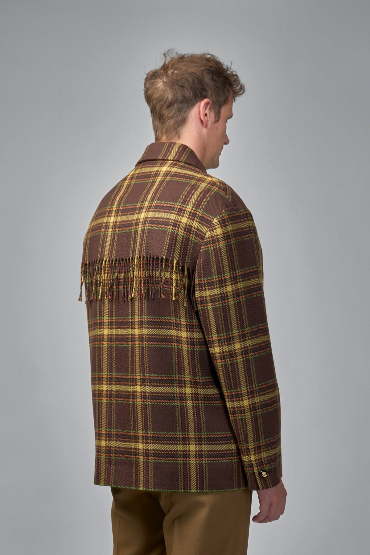 Detail shot of gold-tone decorative buttons on Valentino tartan jacket
