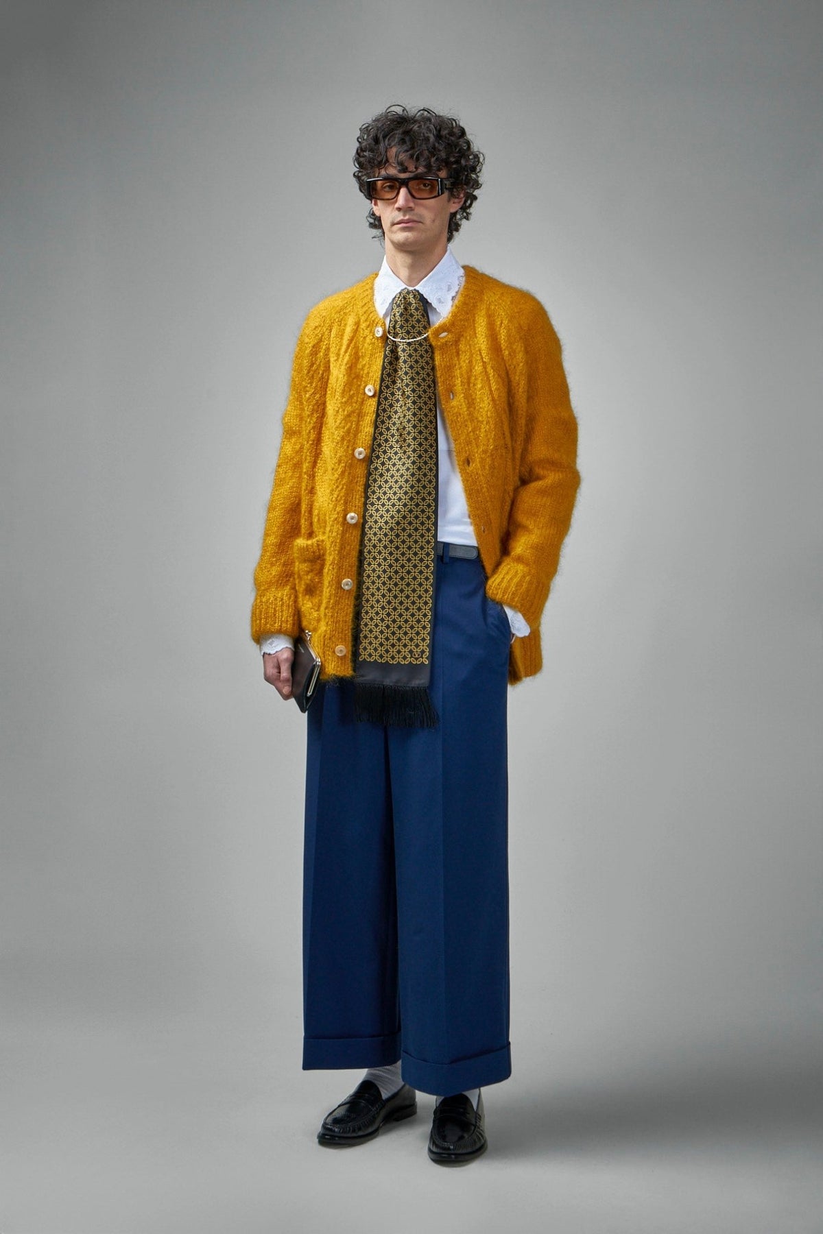 Close-up of button-detailed side pockets on Valentino cotton trousers