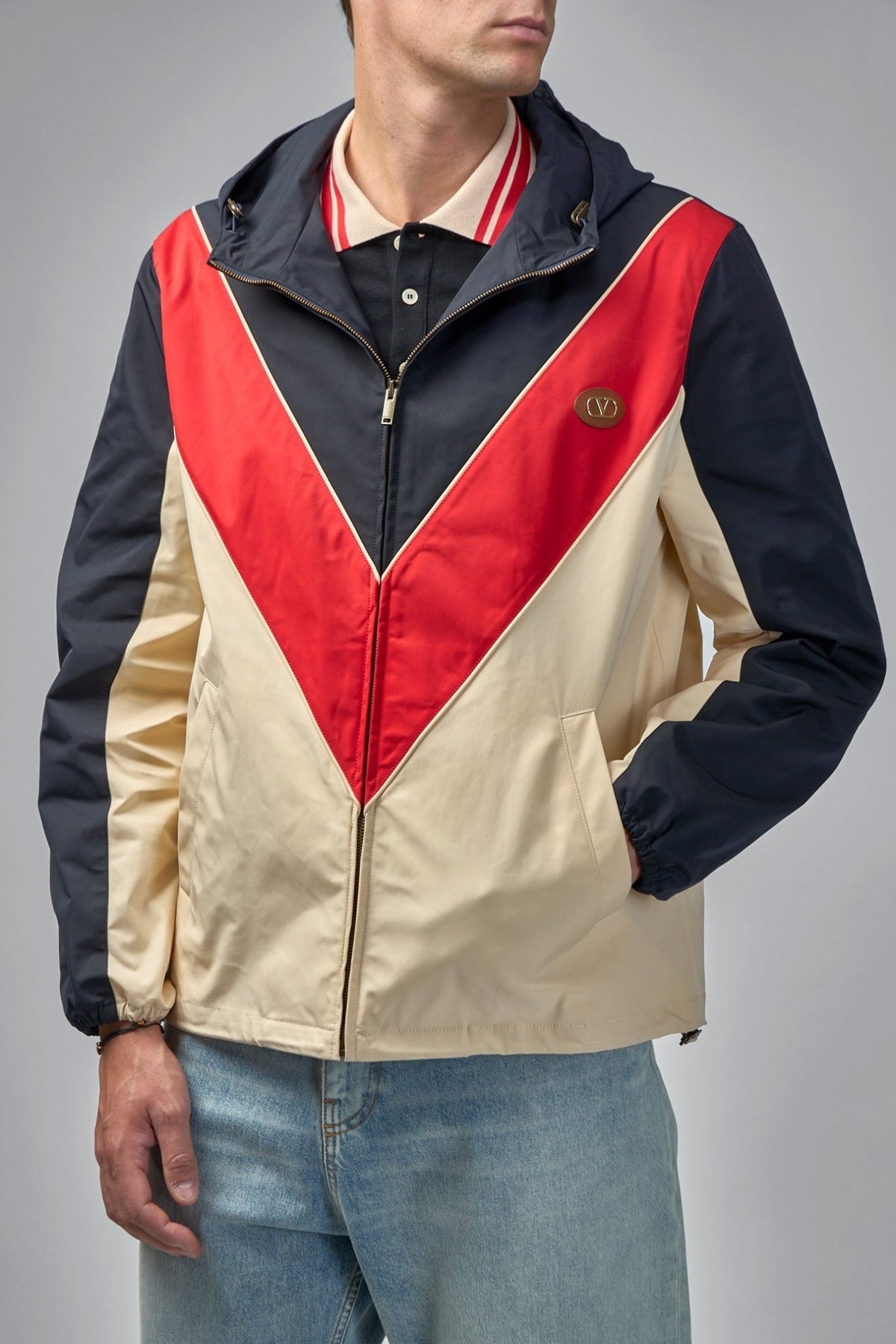 Side profile showing welt pockets on Valentino signature jacket