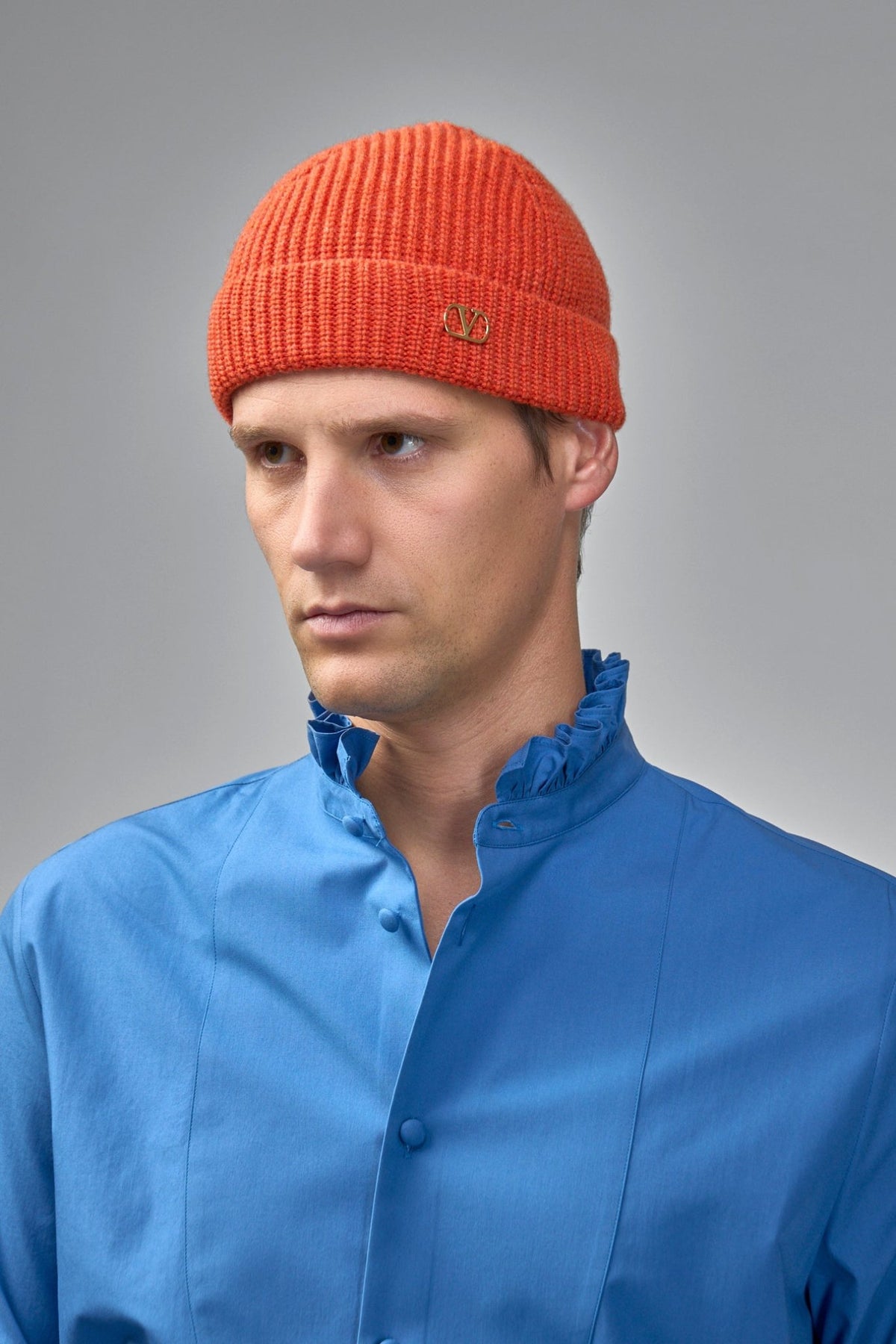 Close-up of Valentino VLogo metal plaque on ribbed cotton beanie cuff