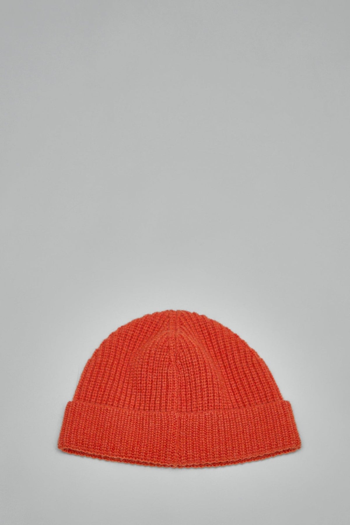 Side view of Valentino signature beanie showing fold-over cuff design
