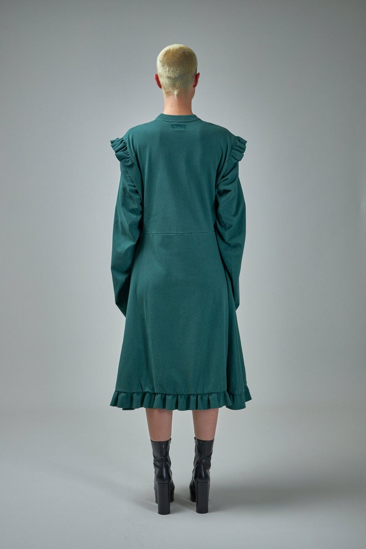 Full-length view of Vetements police-inspired midi dress in cotton
