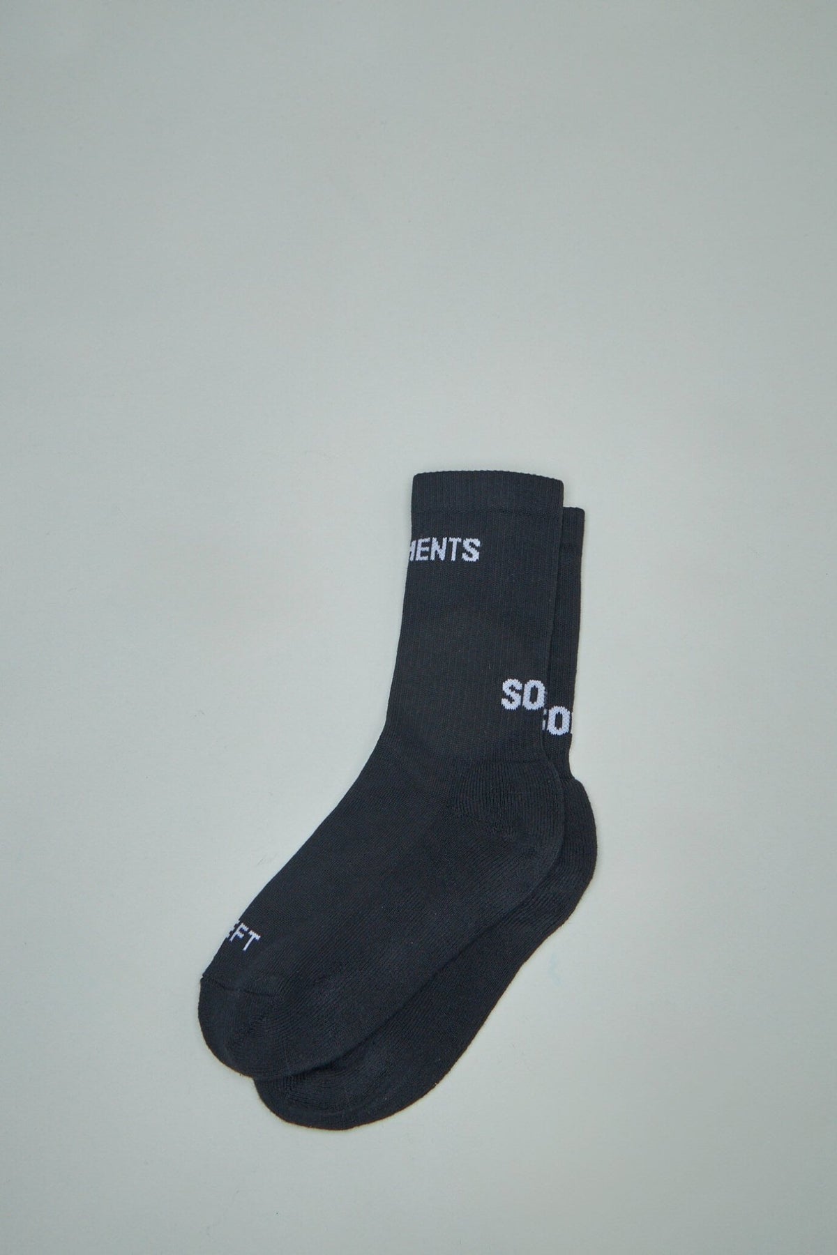 Close-up view of Vetements sock showing elasticated construction and brand logo