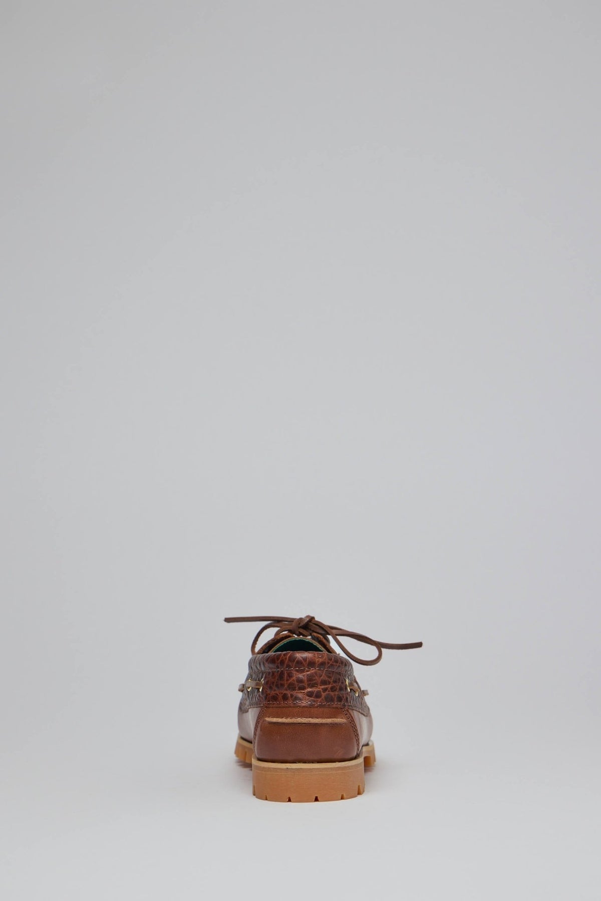 Detail shot of textured leather upper panel on luxury boat shoe