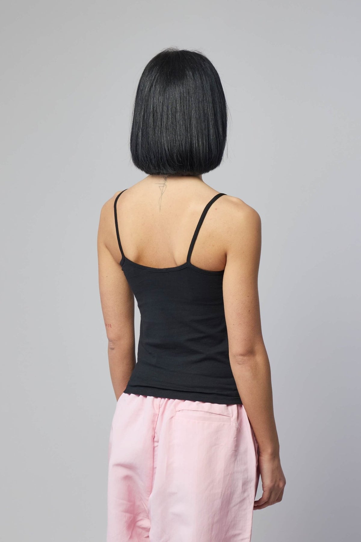Flat lay of Willy Chavarria tank showing fabric texture