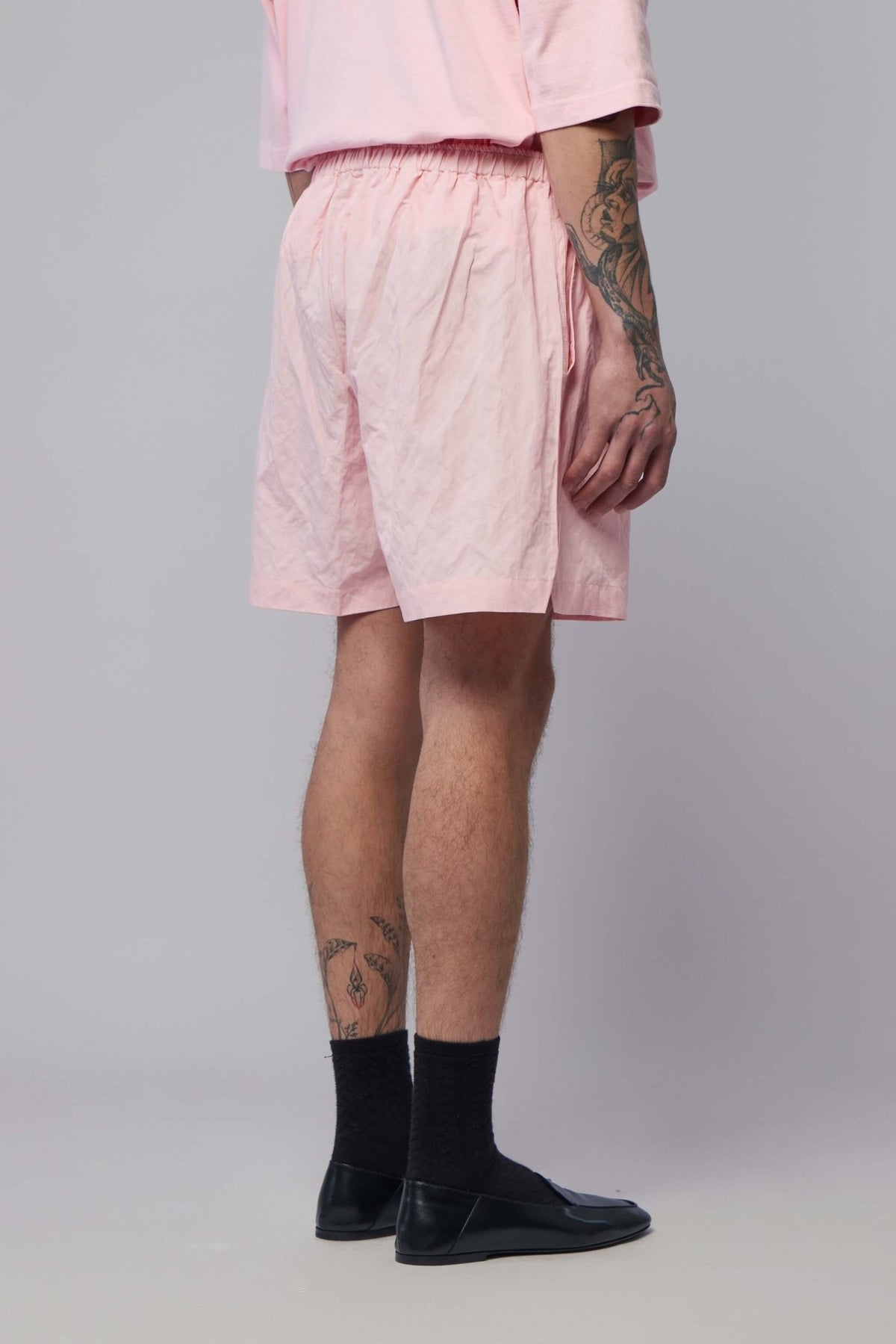Full outfit styling with Willy Chavarria shorts and complementary pieces