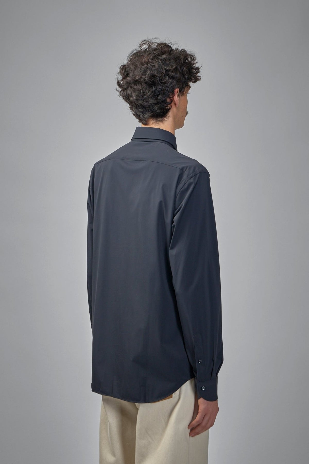 Model wearing Xacus Active Shirt demonstrating professional styling