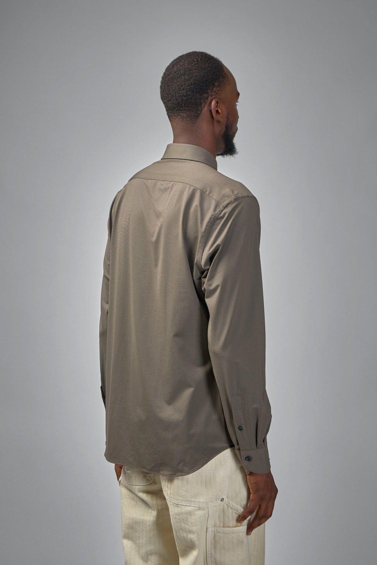 Model wearing Xacus Active Shirt demonstrating true-to-size fit and elegant silhouette