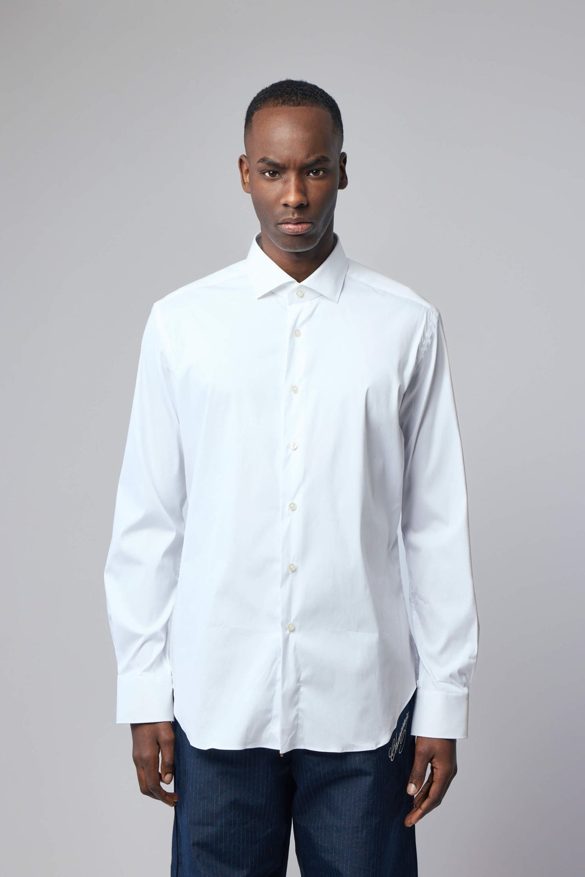 Close-up of Xacus shirt collar and button details showing premium craftsmanship