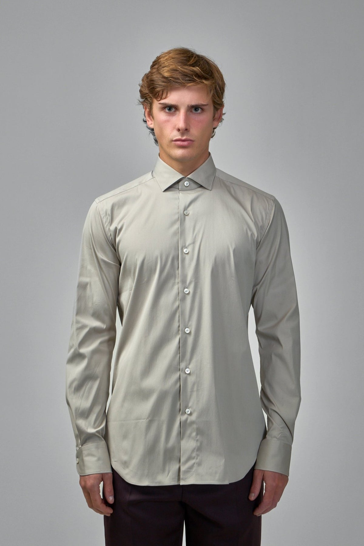 Close-up of Xacus shirt showing smooth cotton blend fabric texture and white buttons