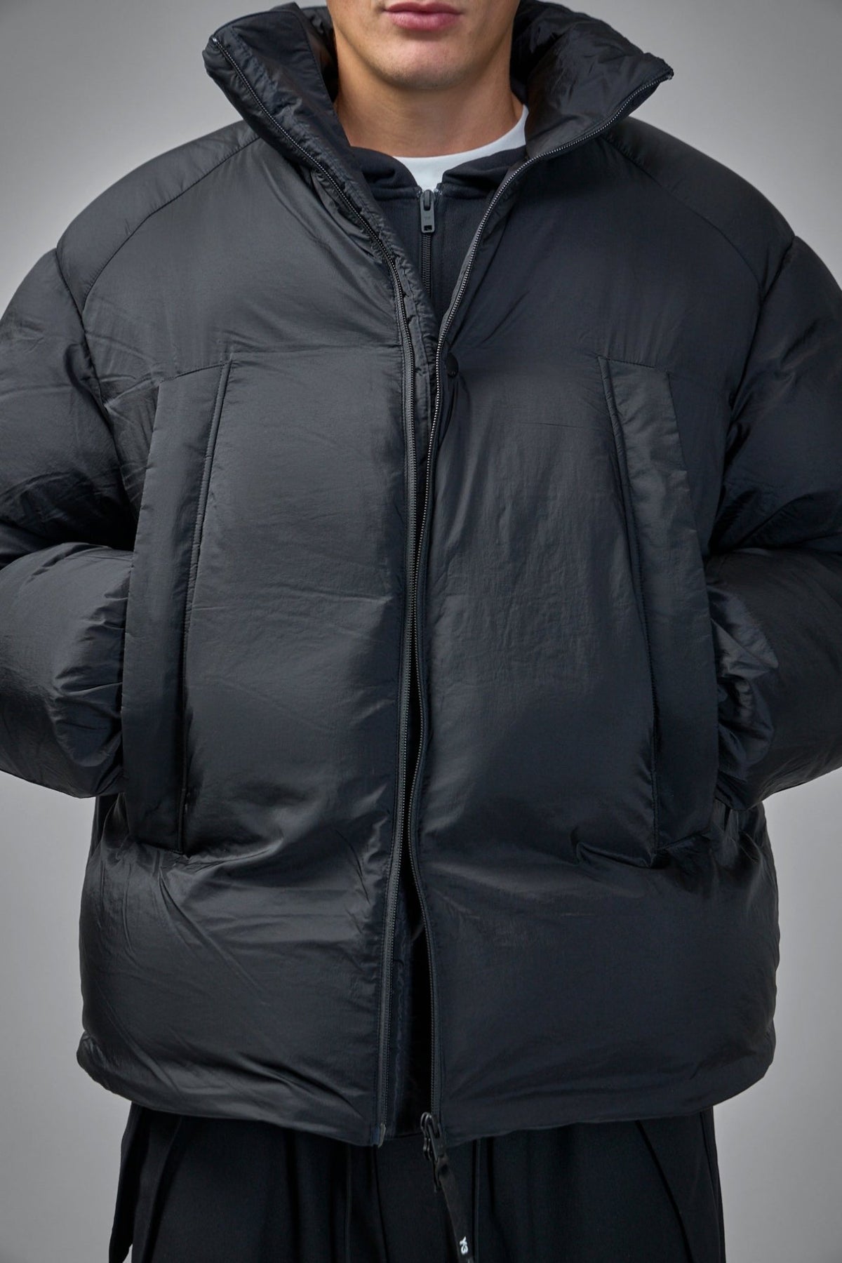 Y-3 puffer jacket front pockets and vertical zip closure detail