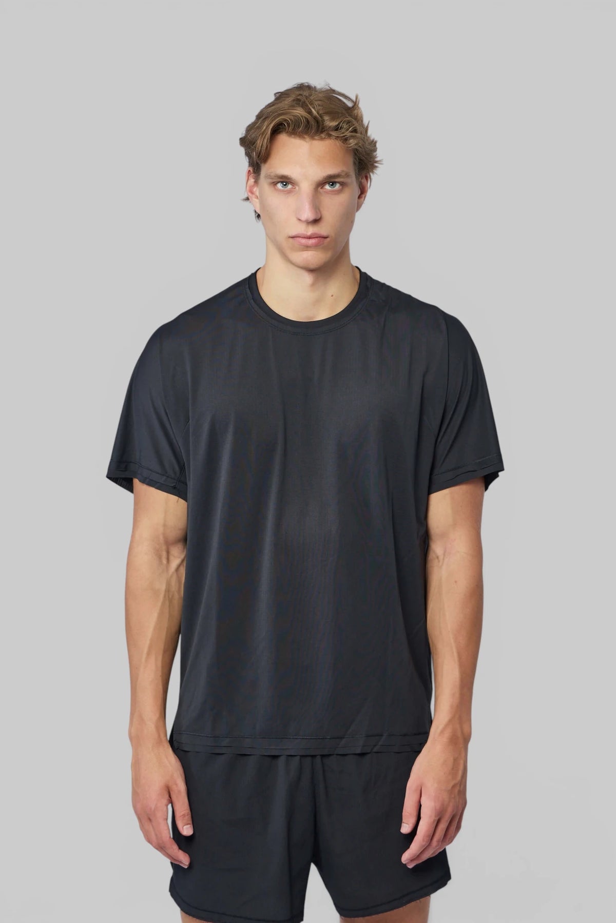 Model wearing Y-3 Yohji Yamamoto M Run SS Tee RC with joggers