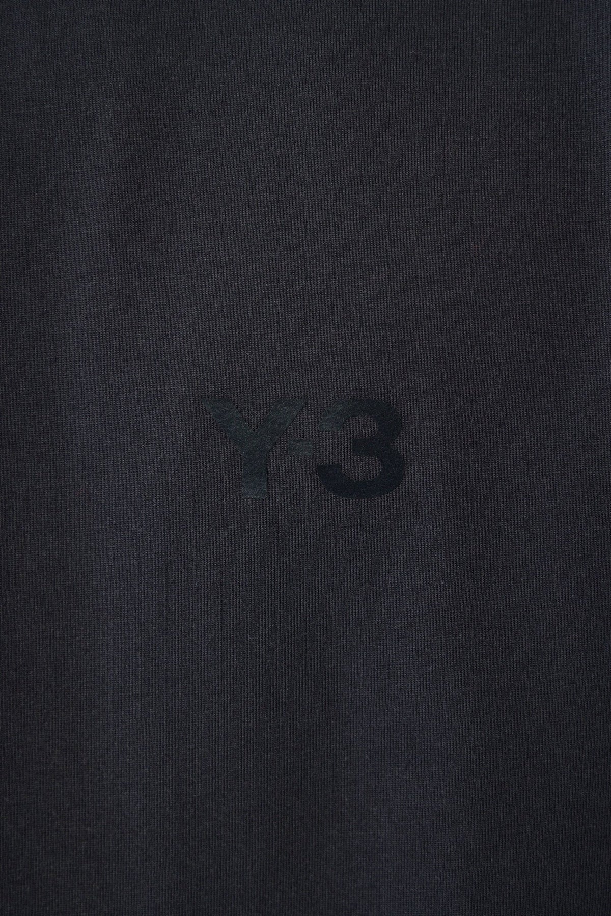 Back view of U LS Tee showing clean minimalist design aesthetic