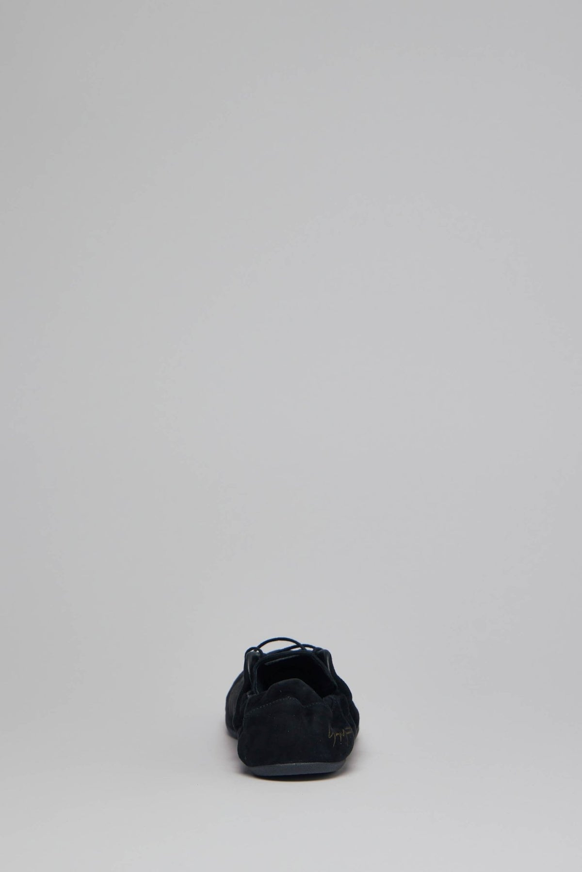 Back view of Y-3 low top sneakers highlighting premium leather construction